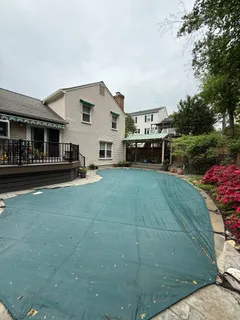 a view of a house with a yard and sitting area