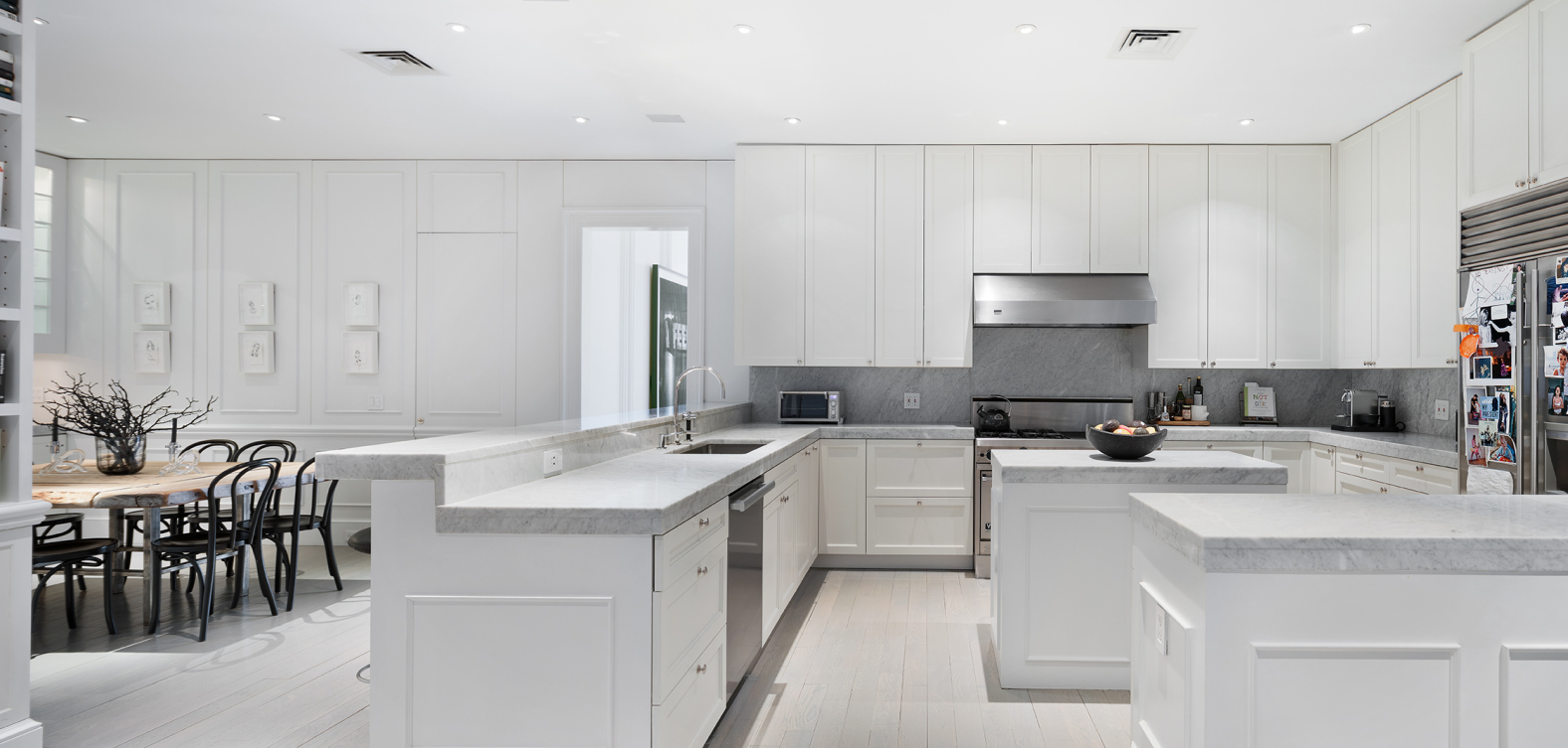 114 Liberty Street, Unit 4 Manhattan, NY 10006 - Photo 8 of 13 a kitchen with sink a cabinets and dining table