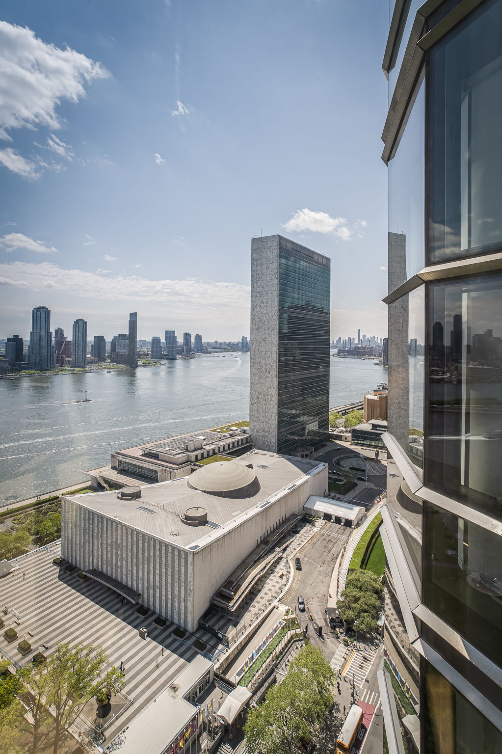 50 United Nations Plaza, Unit 26B Manhattan, NY 10017 - Photo 8 of 25 a view of a roof deck with couches and wooden floor