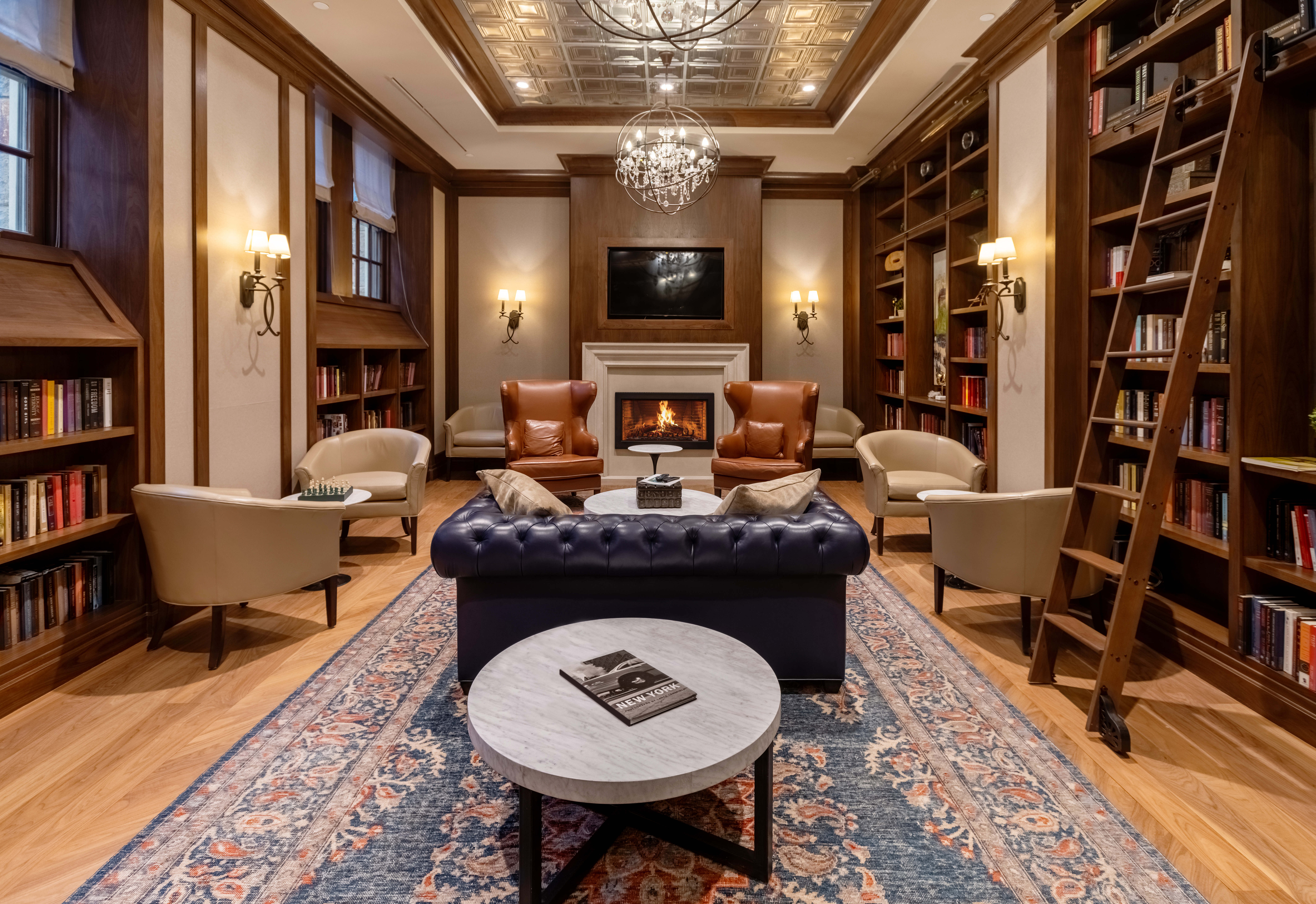 a living room with furniture and a bookshelf