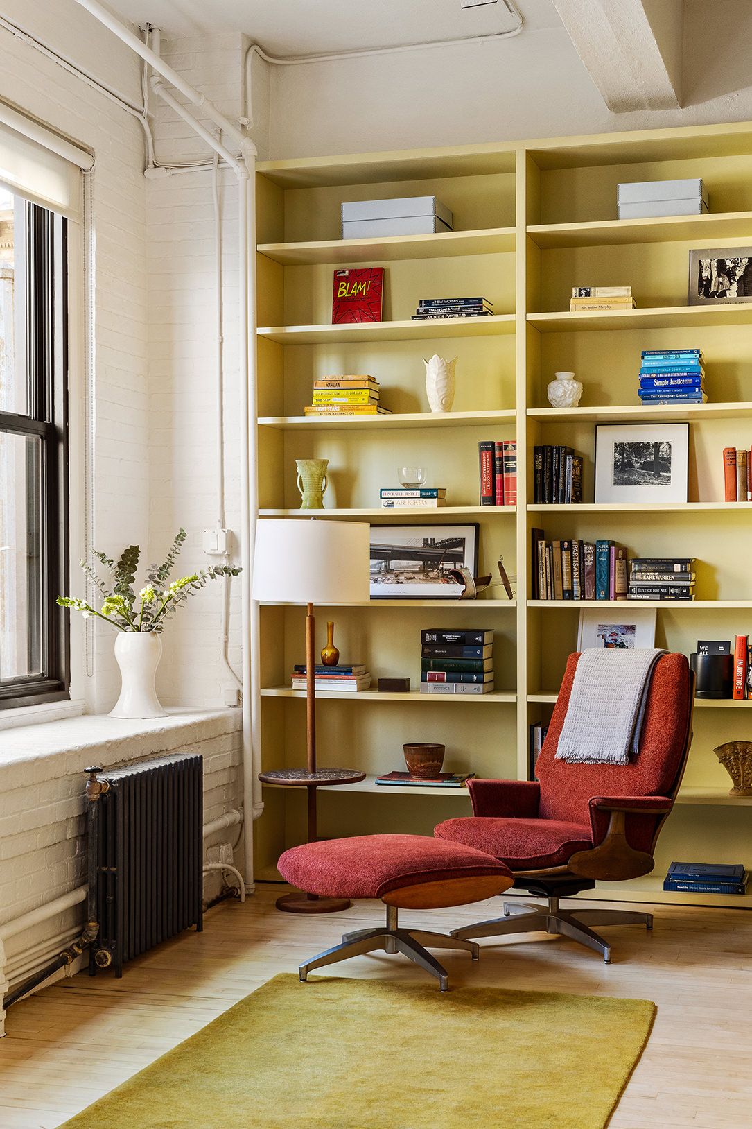 20 Jay Street, Unit 2/3C Manhattan, NY 10013 - Photo 4 of 16 a room with furniture and a book shelf