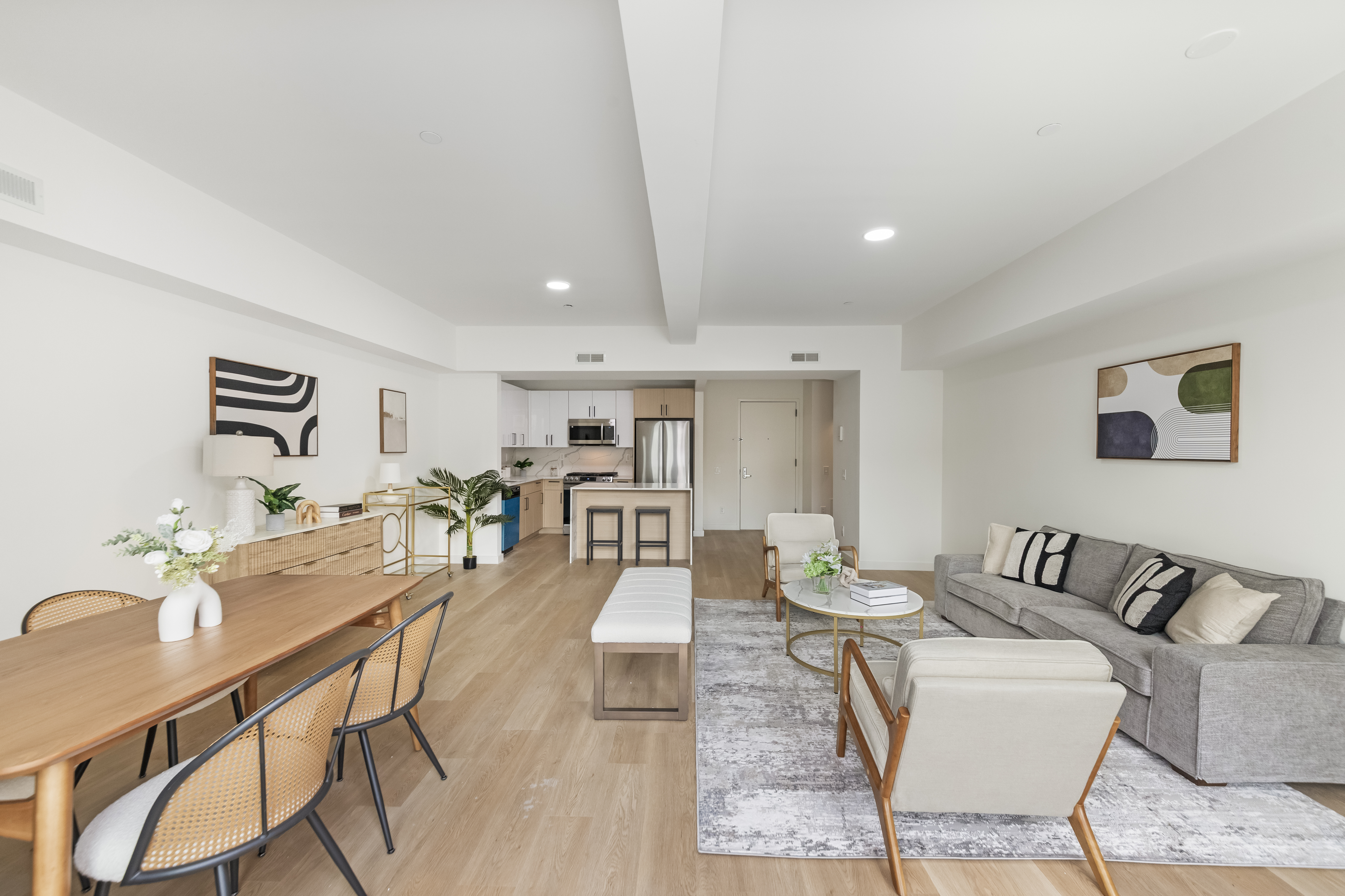 3112 Emmons Avenue, Unit 106 Brooklyn, NY 11235 - Photo 4 of 11 a living room with furniture and wooden floor