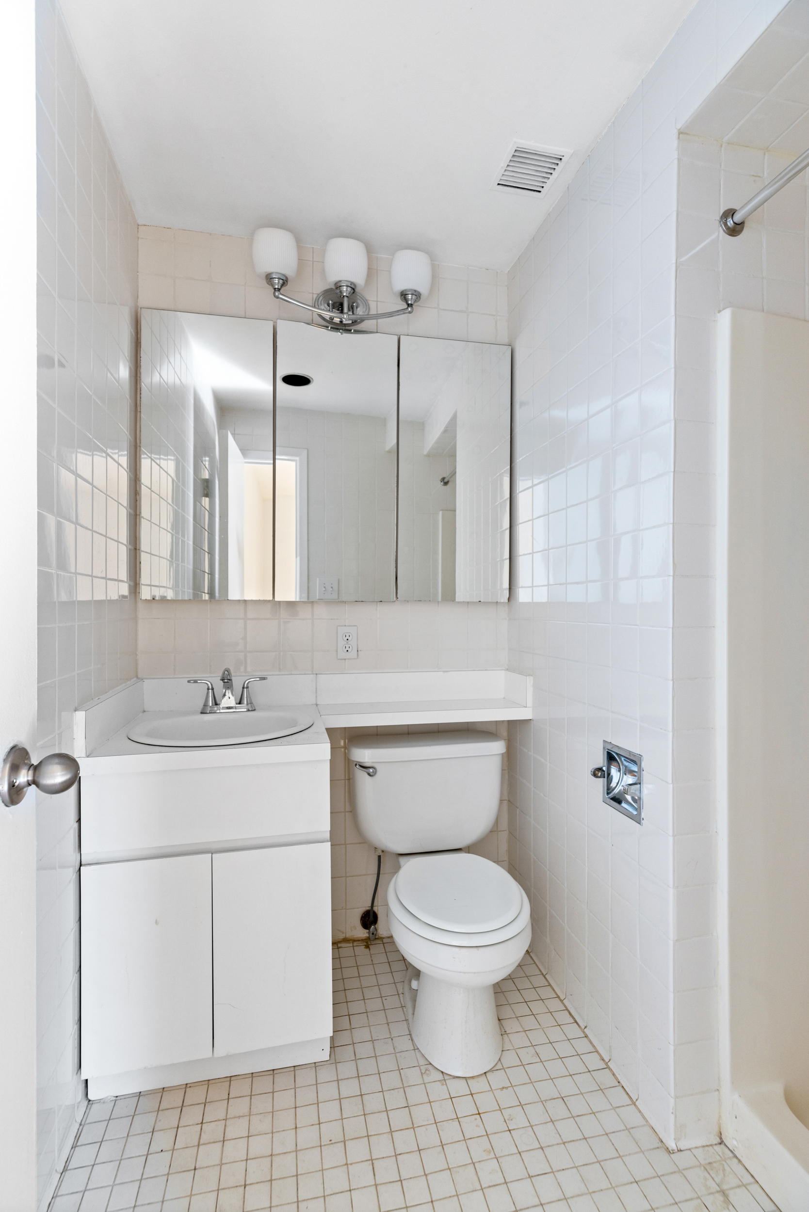 136 East 30th Street, Unit 3R Manhattan, NY 10016 - Photo 11 of 23 a bathroom with a toilet sink and mirror