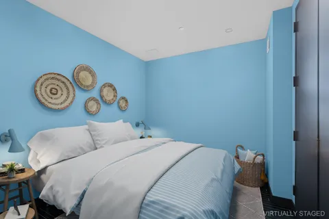 a bedroom with a bed and a chair