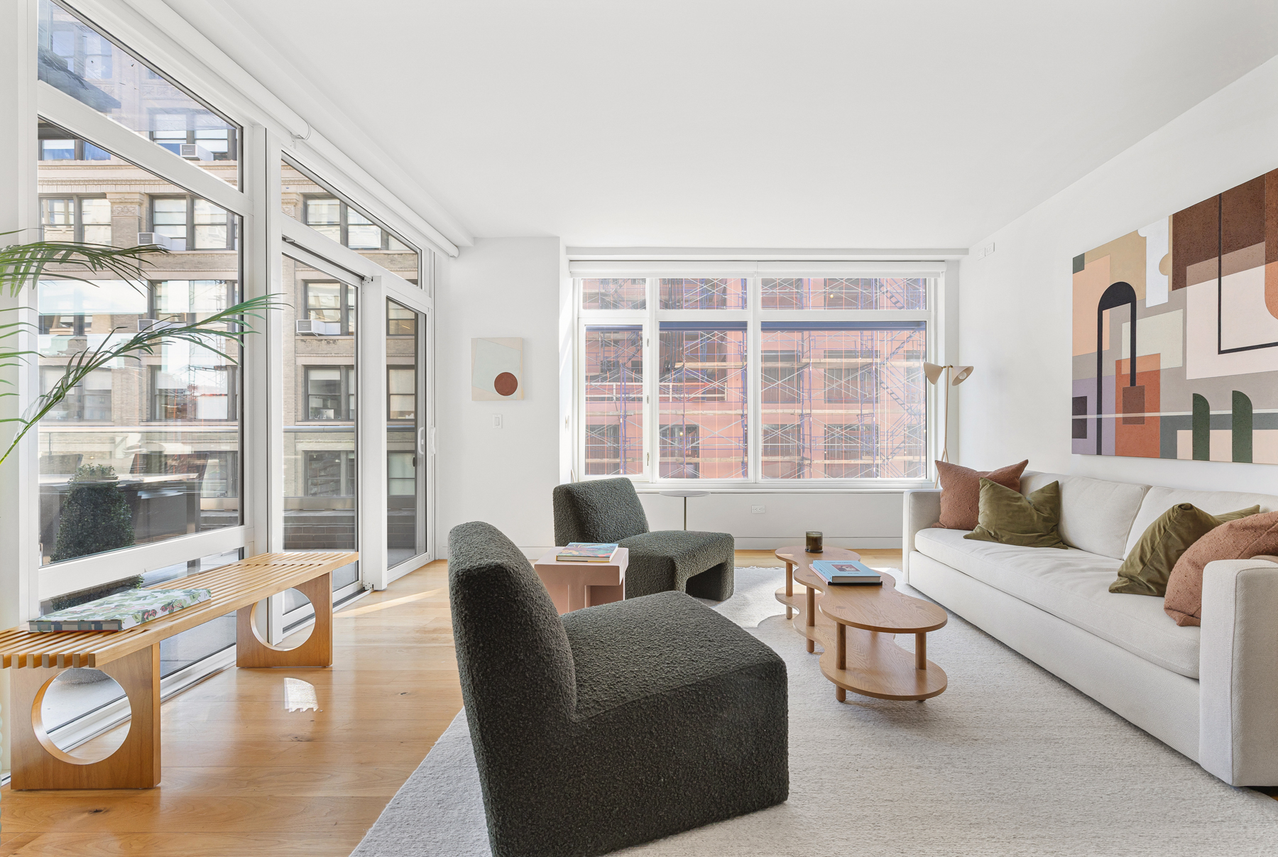 151 West 21st Street, Unit 10A Manhattan, NY 10011 - Photo 6 of 26 a living room with furniture and large windows