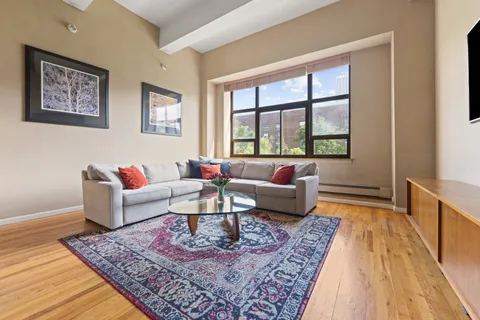 a living room with furniture and a rug