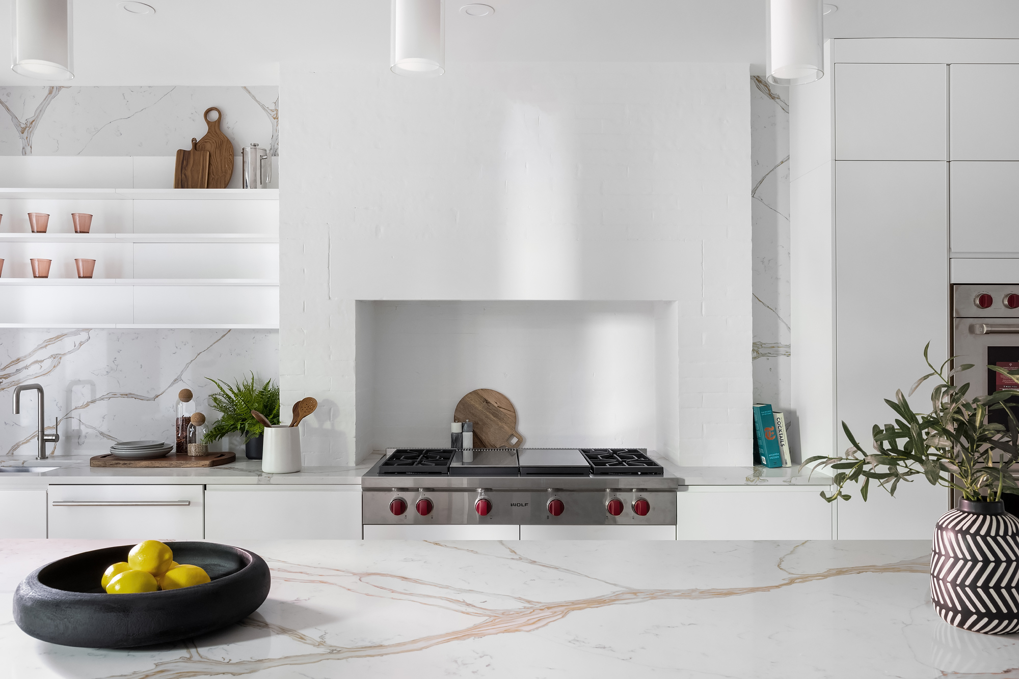 53 West 85th Street Manhattan, NY 10024 - Photo 9 of 37 a kitchen with a sink and a stove with white countertops