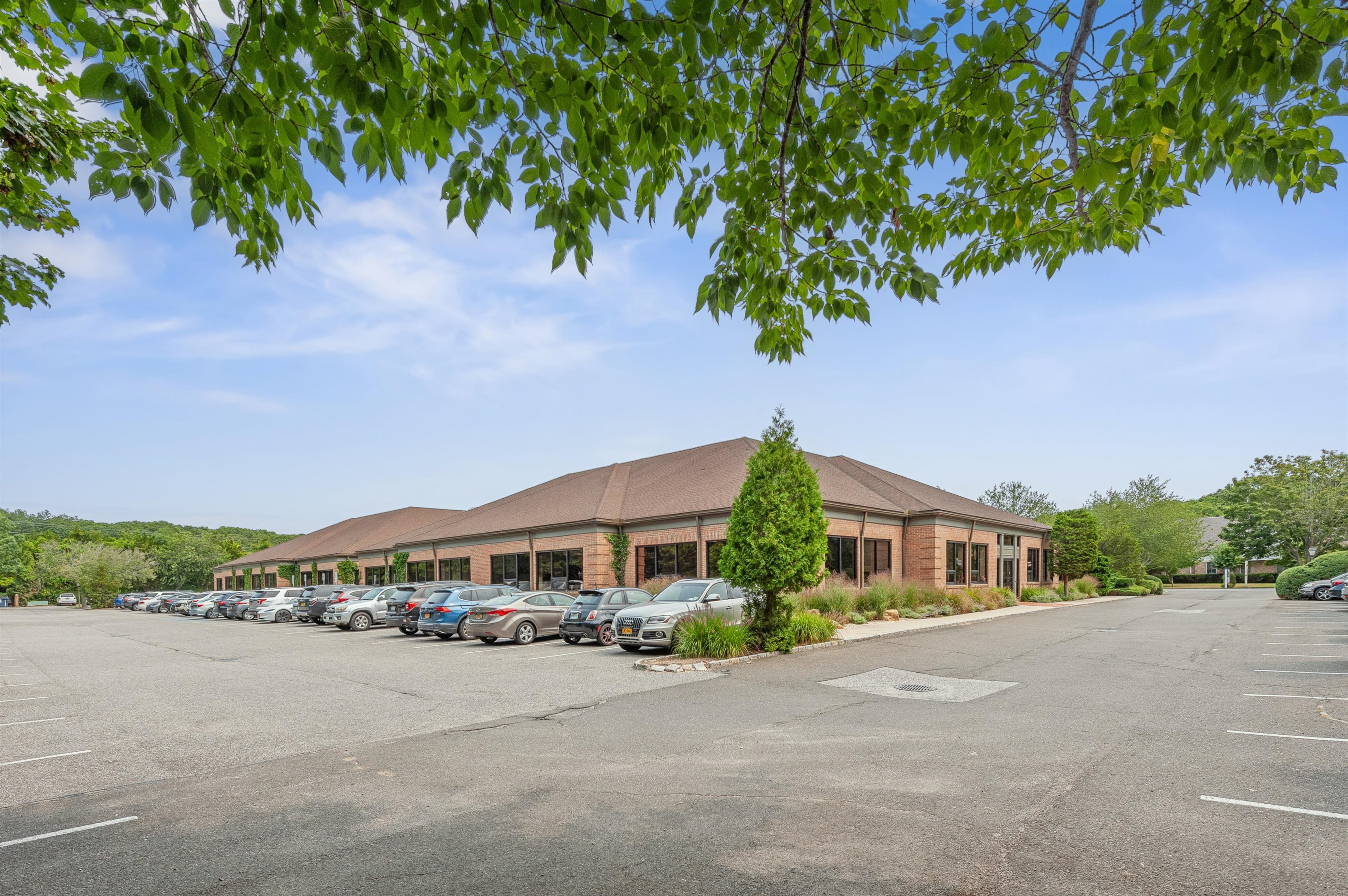 300 Pantigo Road East Hampton, NY 11937 - Photo 4 of 18 a front view of a house with a yard and balcony