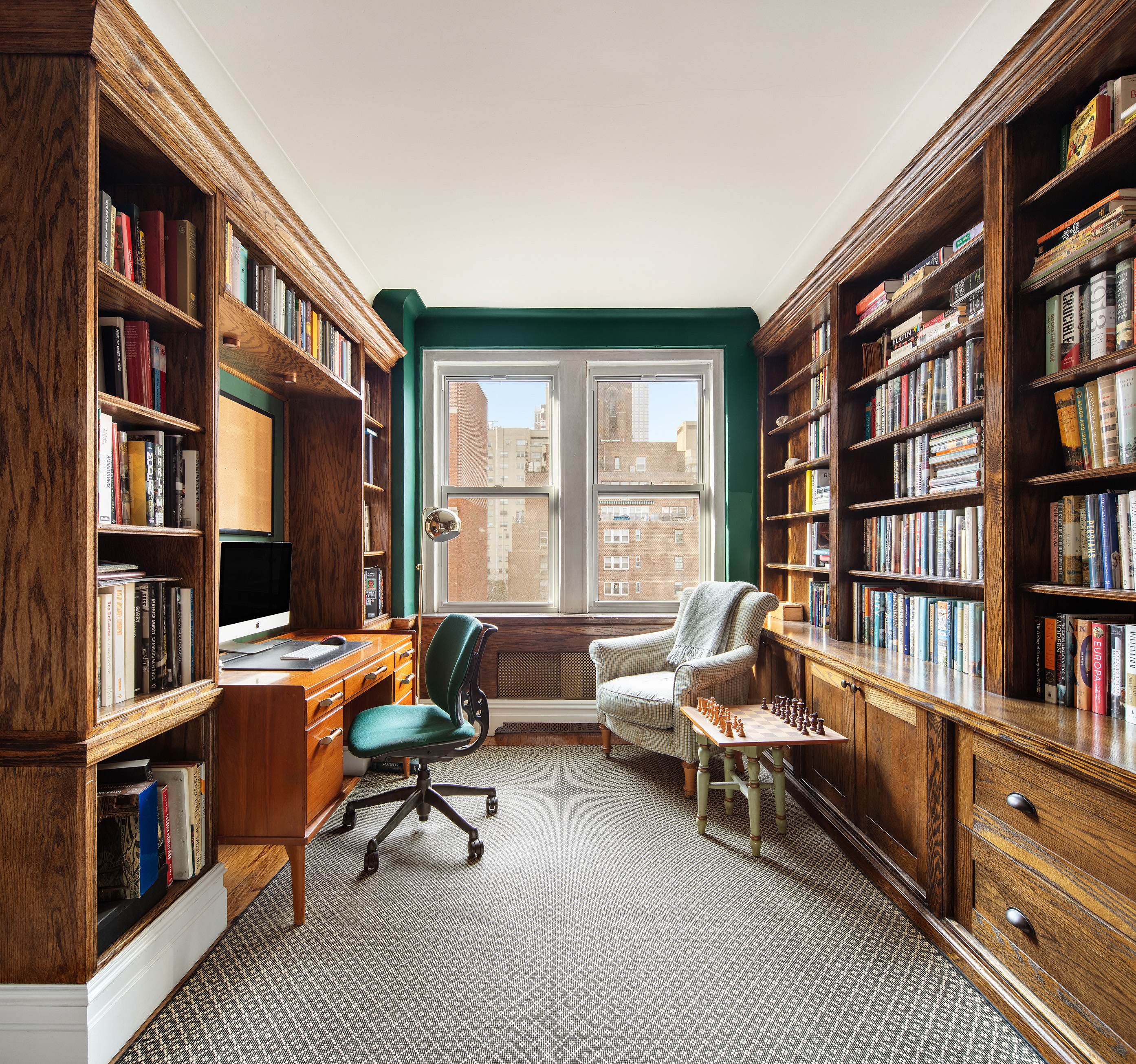 136 East 36th Street, Unit 9/10C Manhattan, NY 10016 - Photo 6 of 16 a reading room with furniture window and book shelf