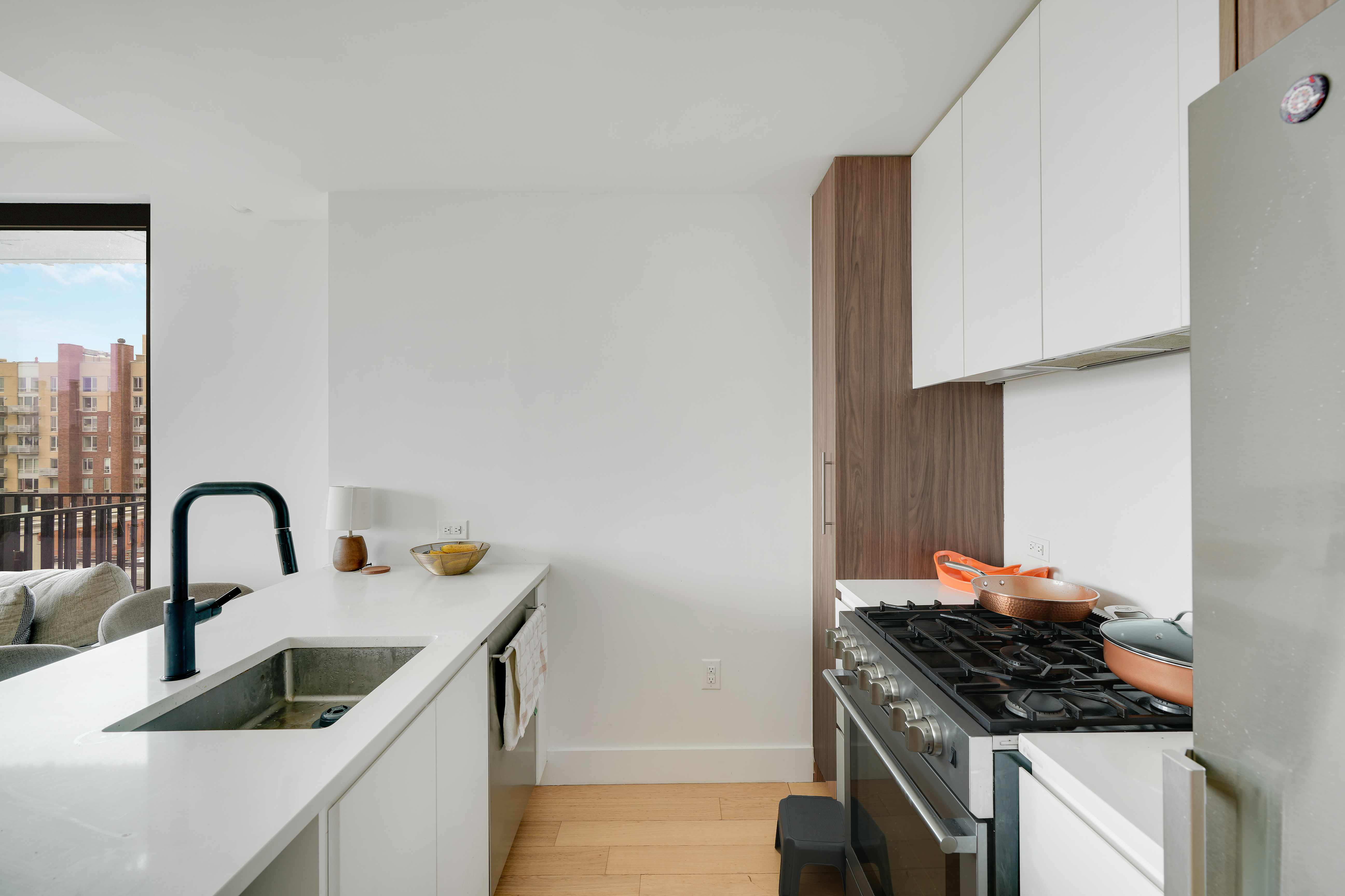 224 West 124th Street, Unit 305 Manhattan, NY 10027 - Photo 5 of 23 a kitchen with a stove and a sink