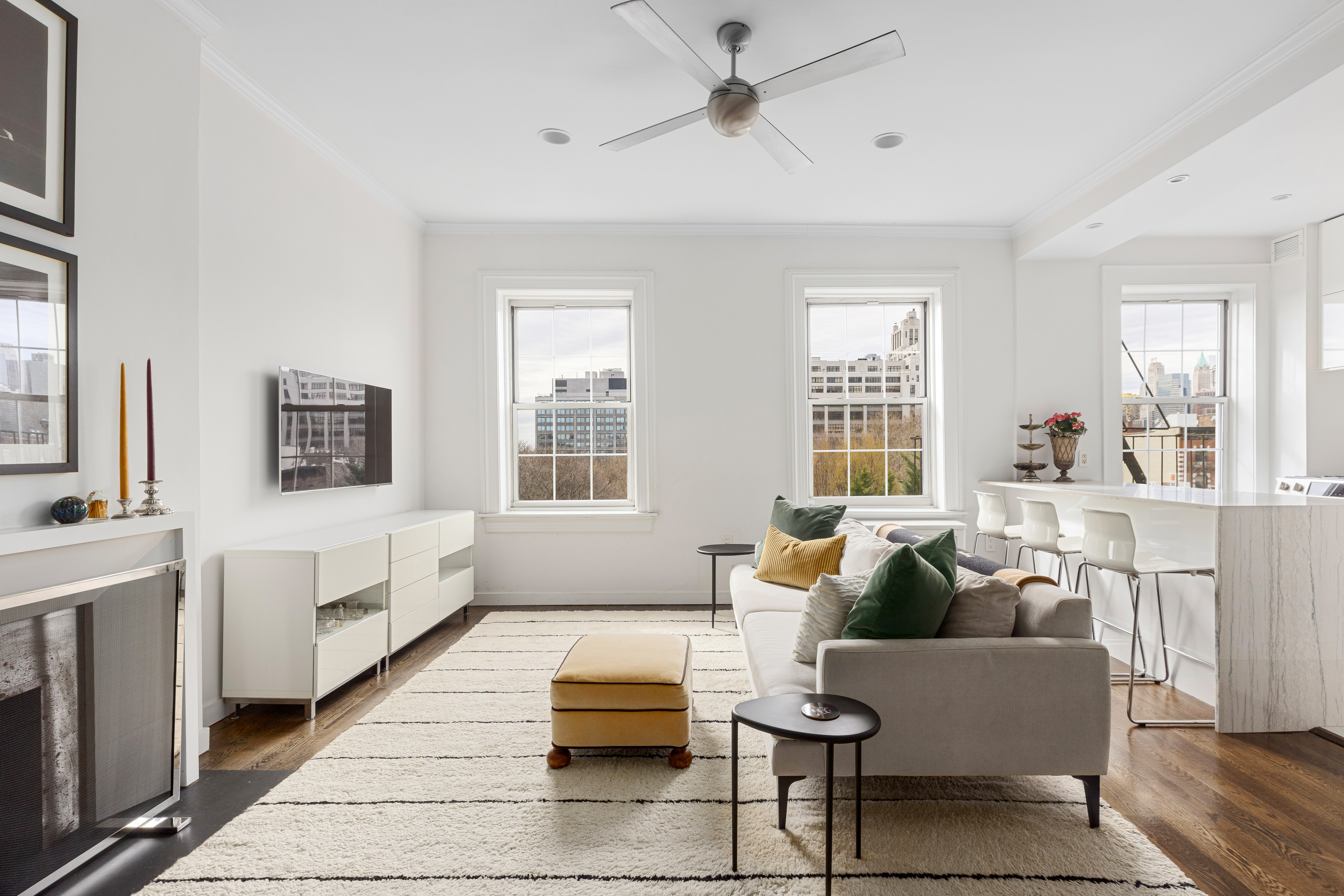 a living room with furniture and windows