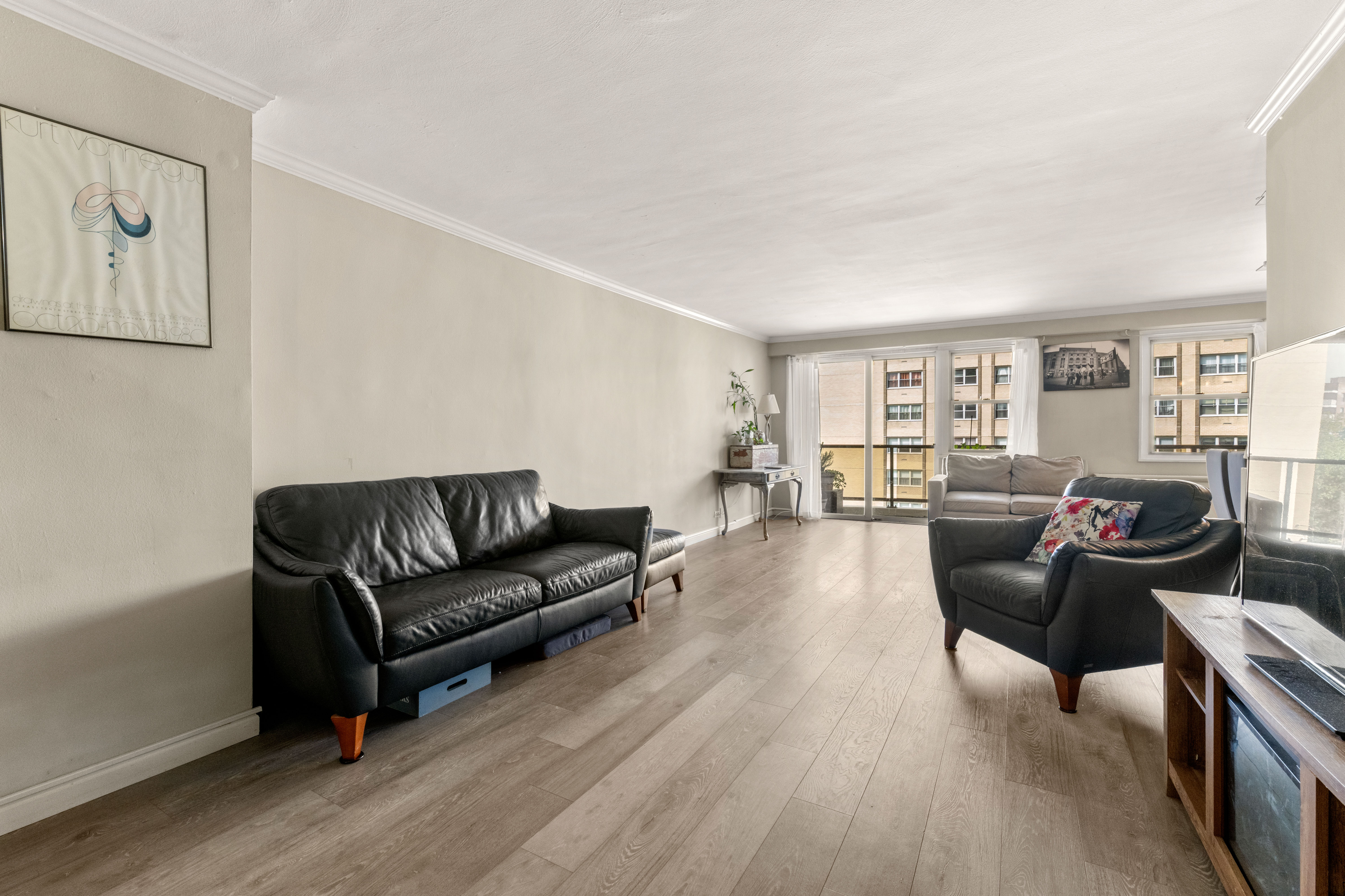 102-30 66th Road, Unit 7E Queens, NY 11375 - Photo 3 of 15 a living room with furniture and a wooden floor