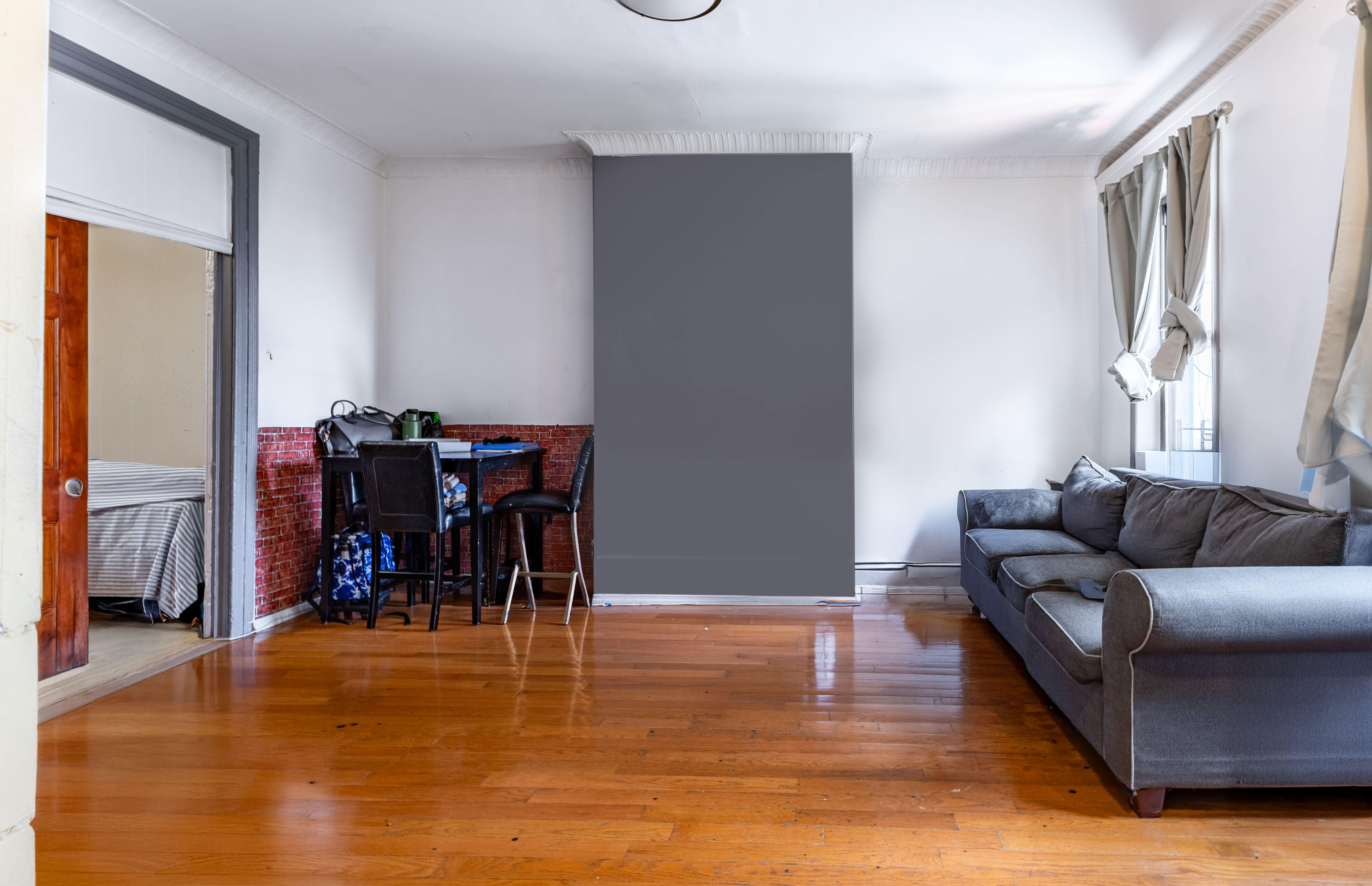 52 Himrod Street Brooklyn, NY 11221 - Photo 7 of 16 a living room with furniture and a dining table with wooden floor