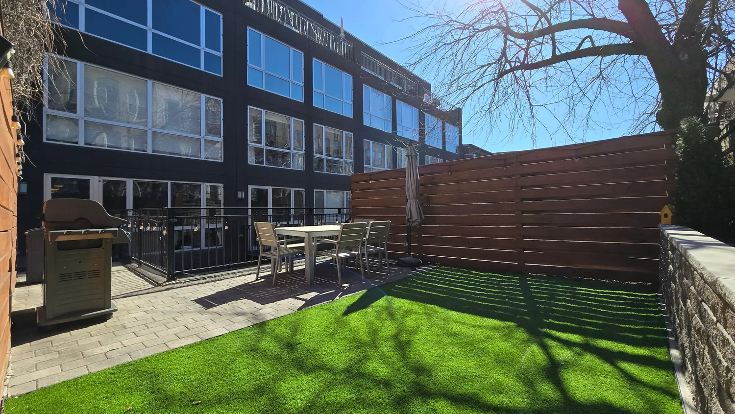 a pathway of a house with a yard