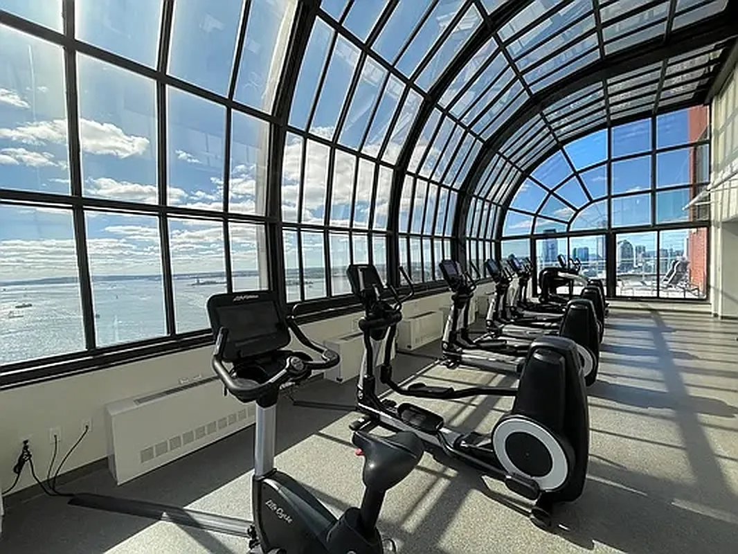 200 Rector Place, Unit 37J Manhattan, NY 10280 - Photo 7 of 12 a view of a room with gym equipment