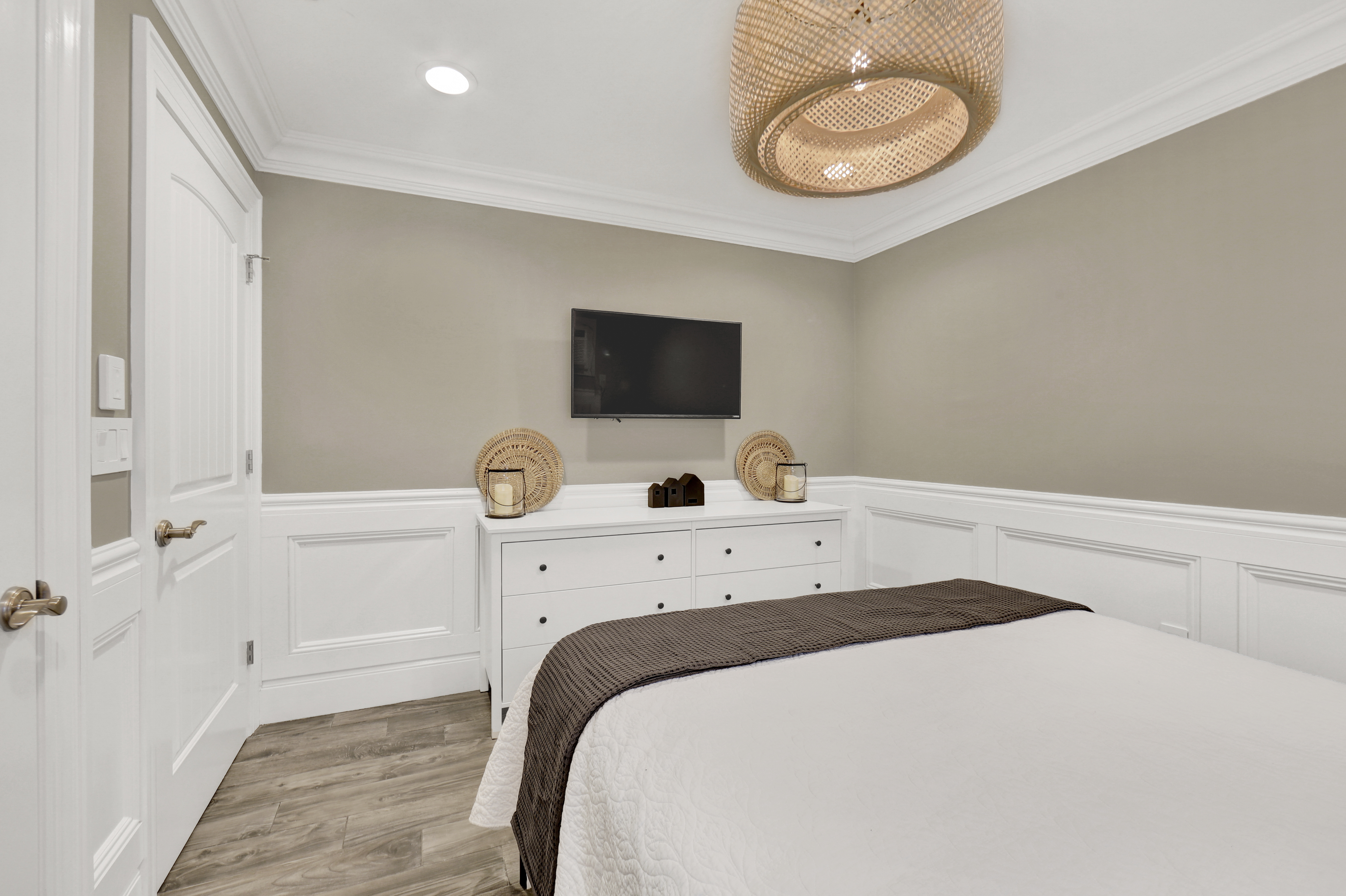 1-69 Beach 98th Street, Unit 1 Queens, NY 11694 - Photo 13 of 23 a bedroom with a bed and a flat screen tv