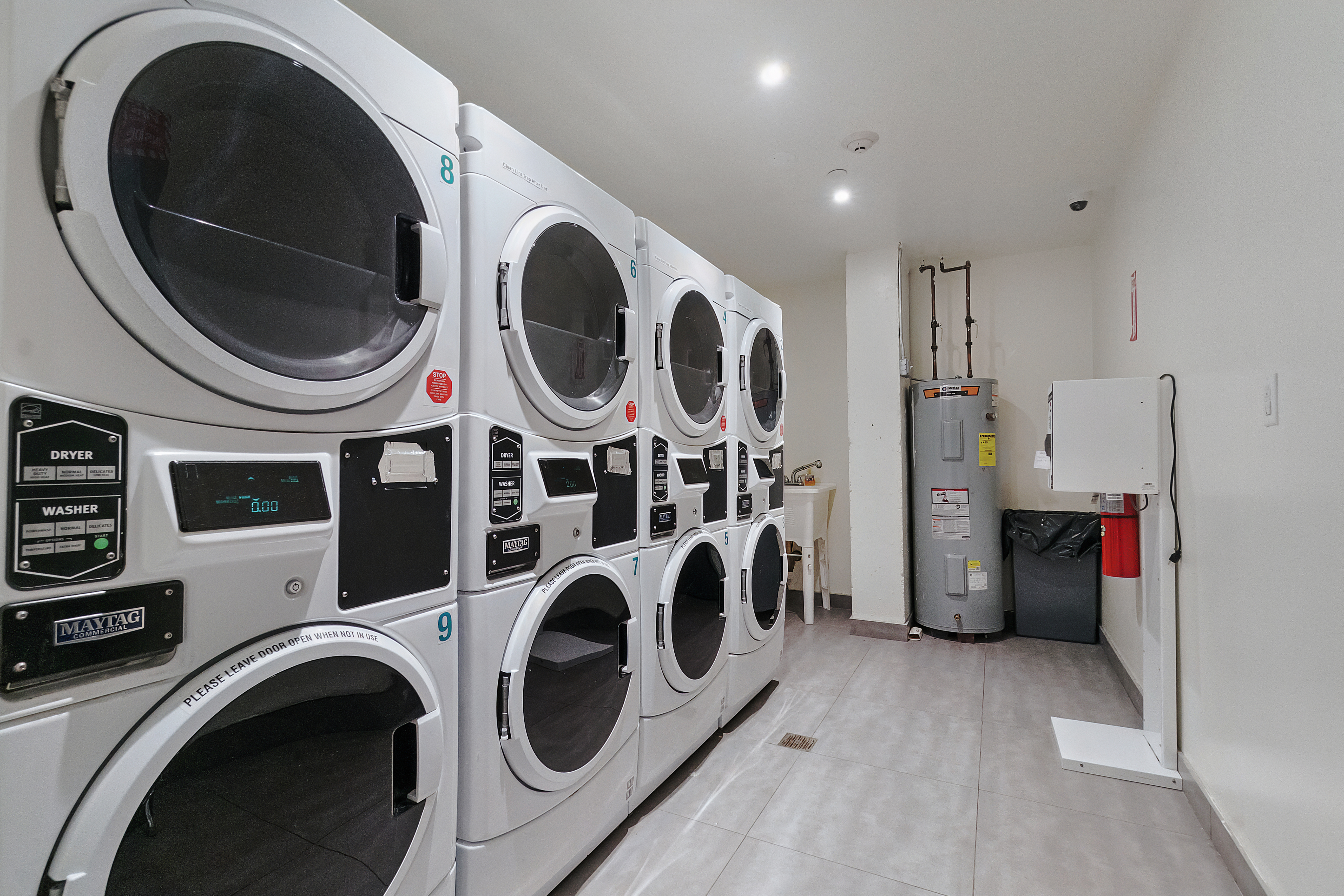 401 Rutland Road, Unit 2C Brooklyn, NY 11203 - Photo 7 of 13 a view of a storage and utility room with dryer and washer