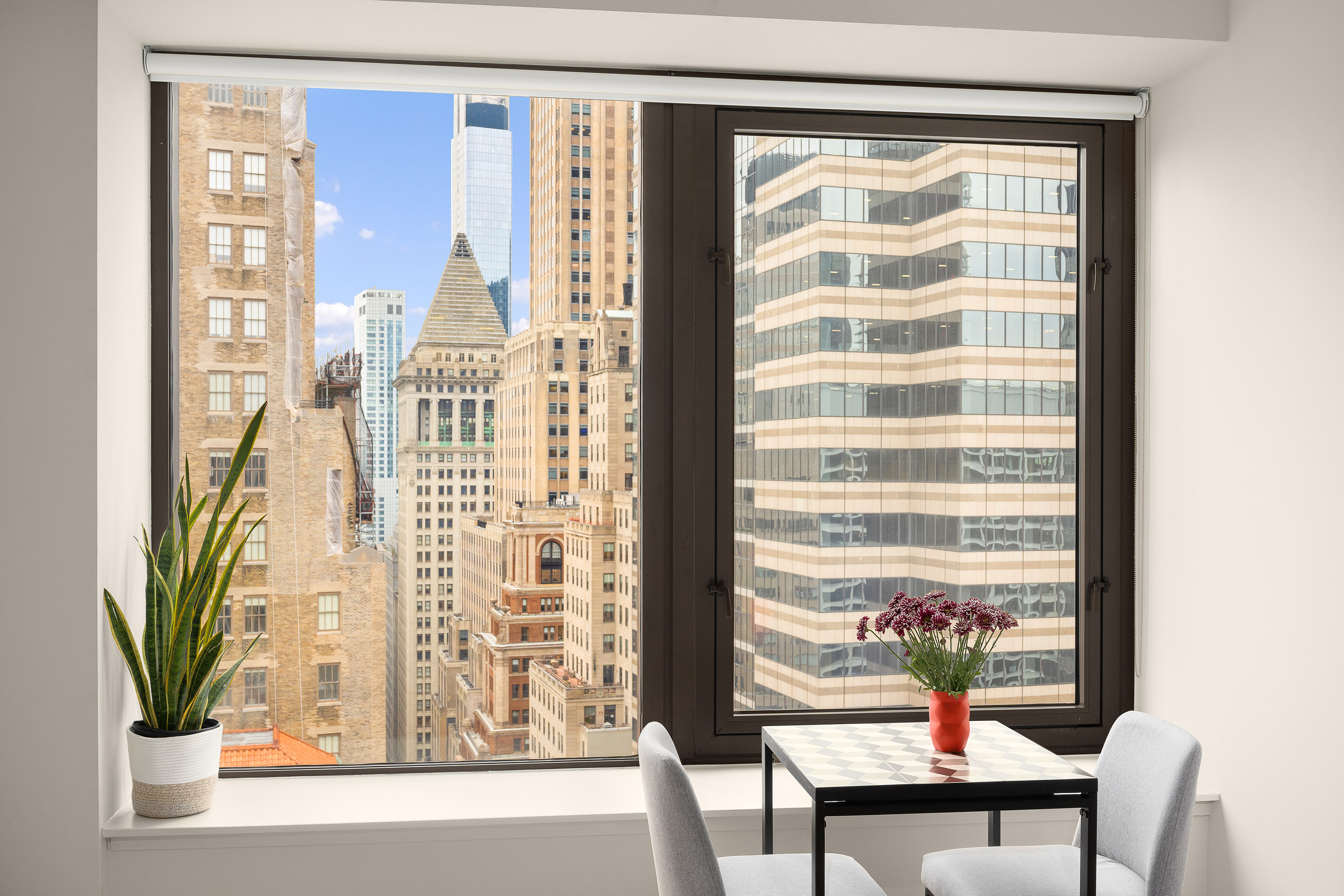 75 Wall Street, Unit 33L Manhattan, NY 10005 - Photo 1 of 5 a view of a living room and a window