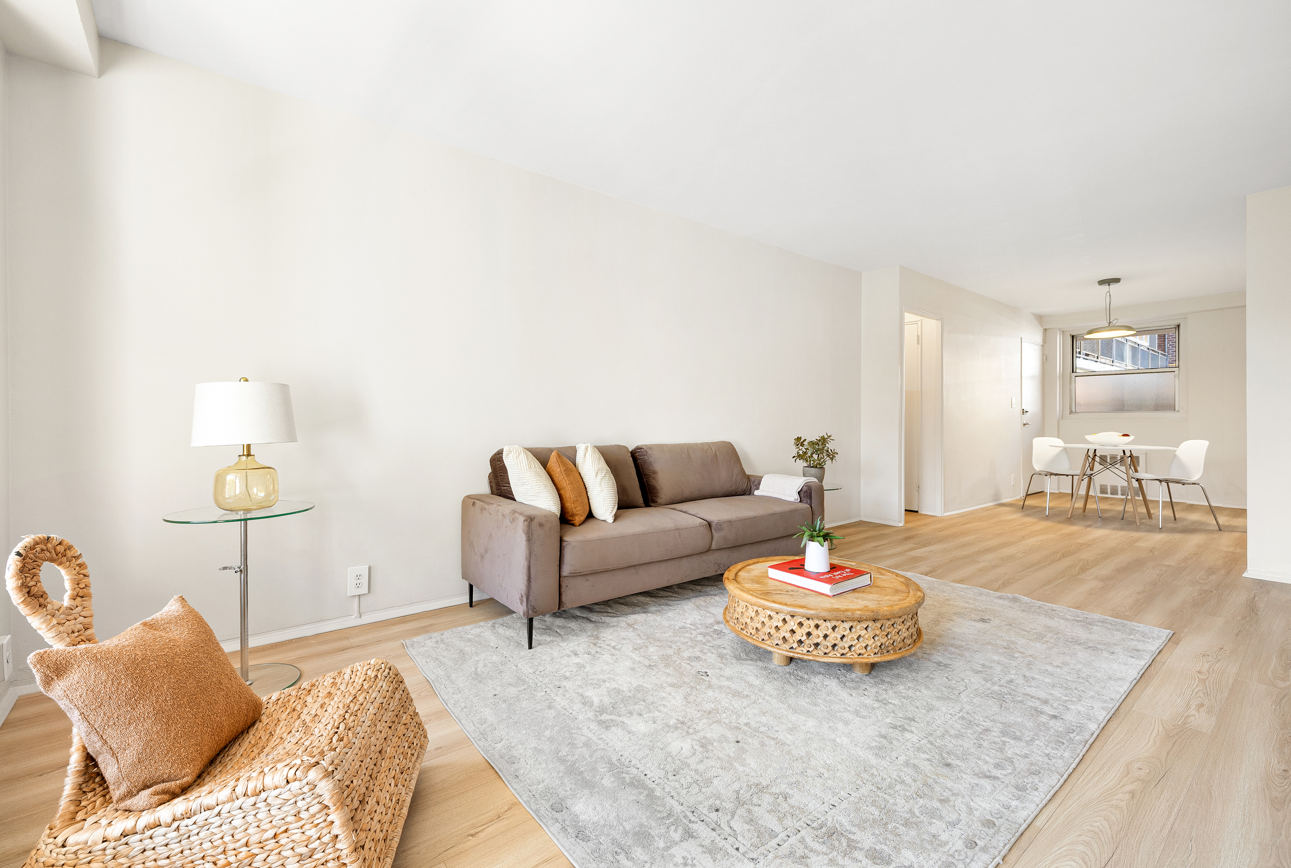 35-51 85th Street, Unit 4M Queens, NY 11372 - Photo 2 of 10 a living room with furniture and a dining room