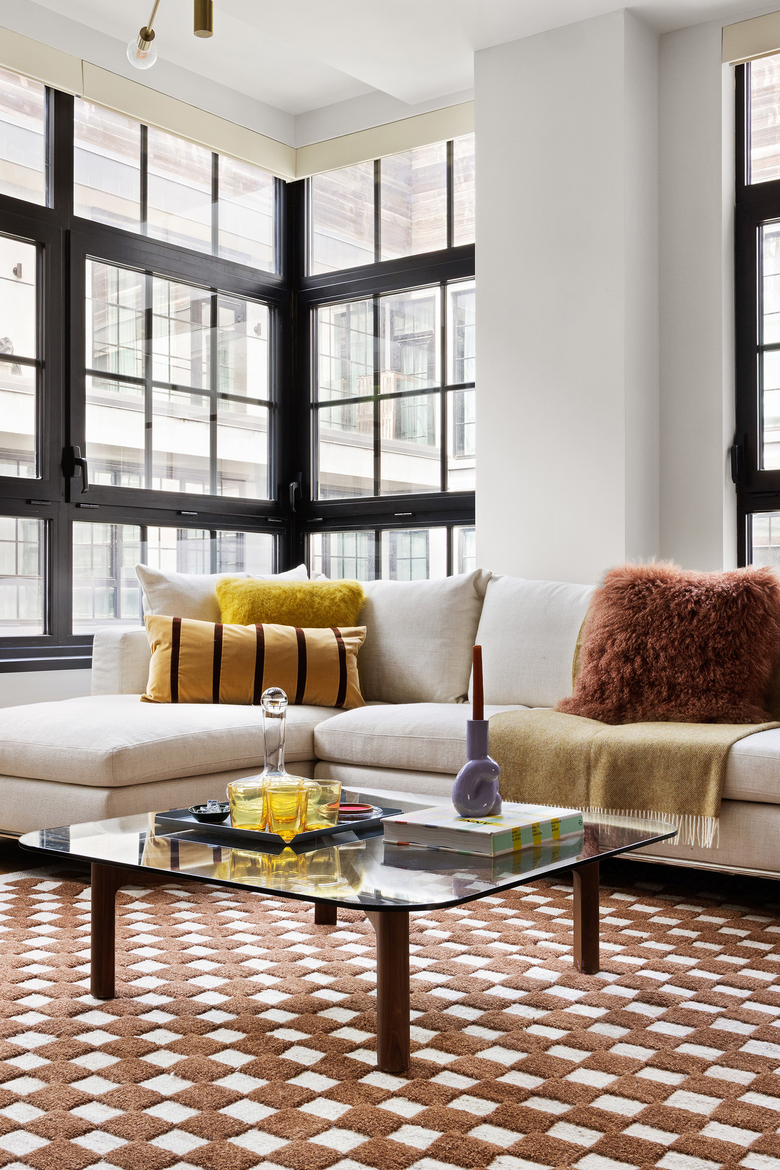 51 Jay Street, Unit 5J Brooklyn, NY 11201 - Photo 6 of 23 a living room with furniture and a floor to ceiling window