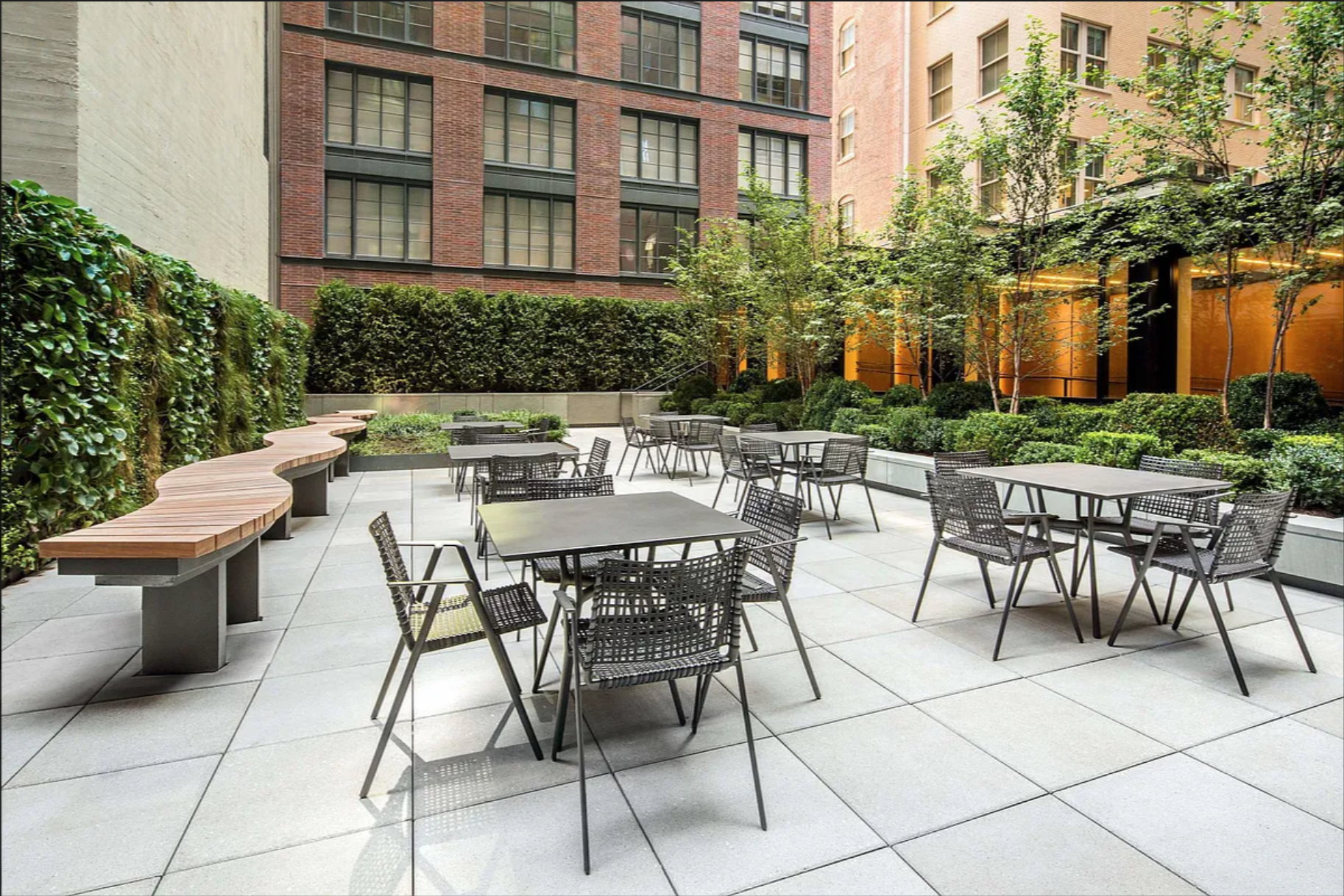 70 Charlton Street, Unit 3F Manhattan, NY 10014 - Photo 14 of 15 a view of a patio with a table and chairs and potted plants