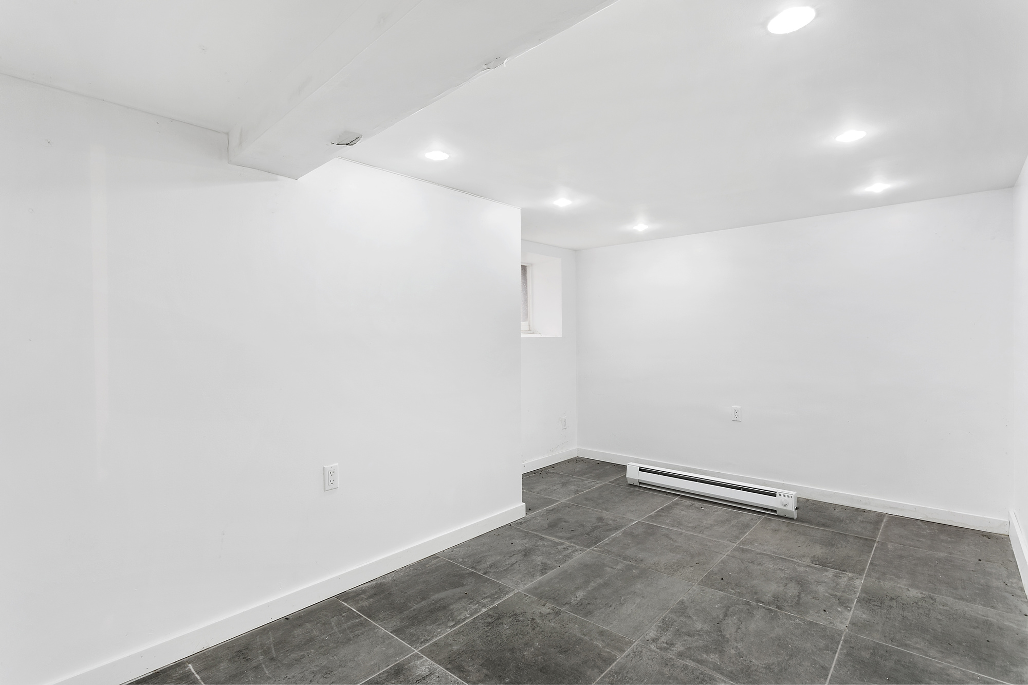 342 East 9th Street Brooklyn, NY 11218 - Photo 9 of 12 a view of a room with an empty space