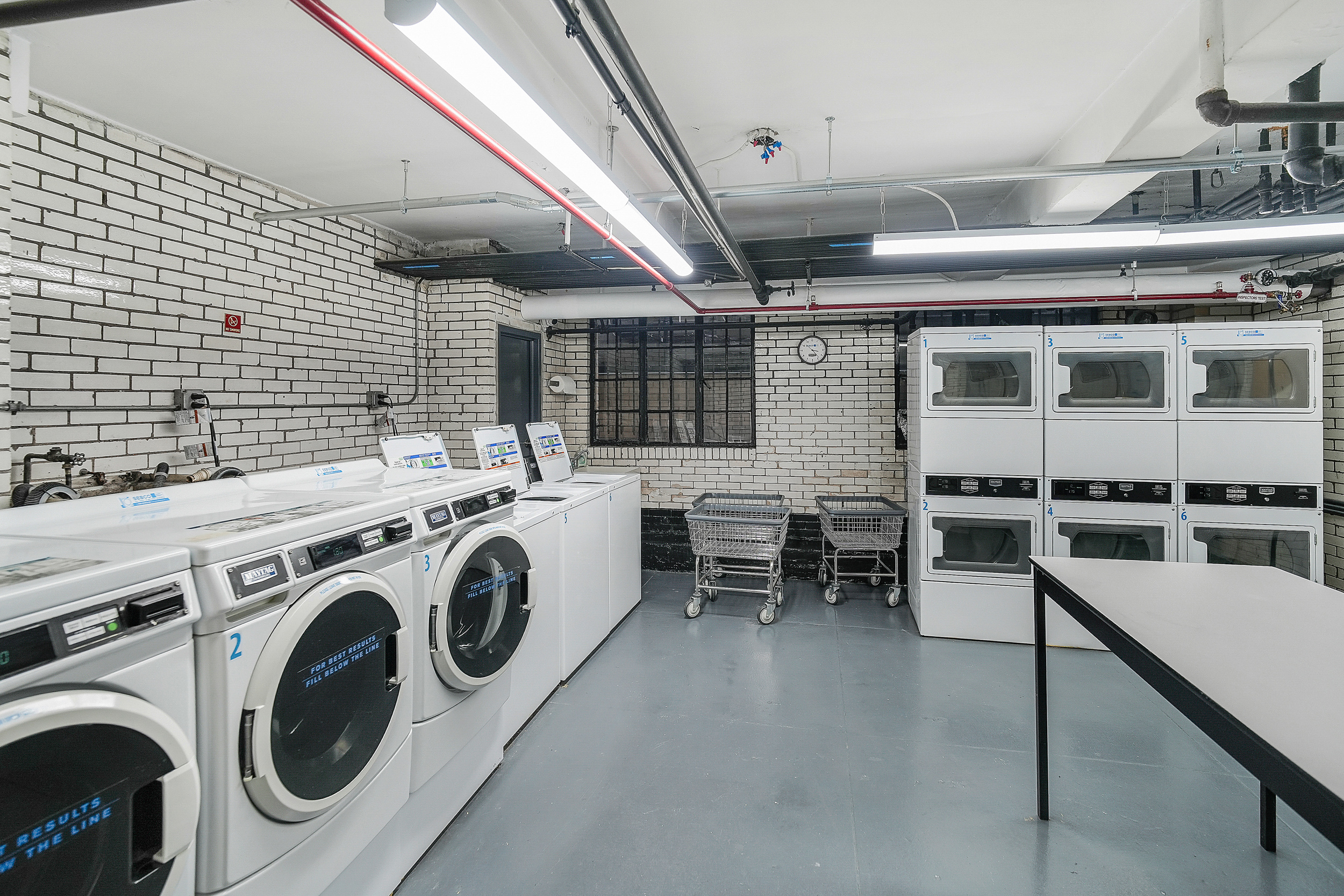 102 West 85th Street, Unit 2B Manhattan, NY 10024 - Photo 14 of 16 a utility room with dryer and washer