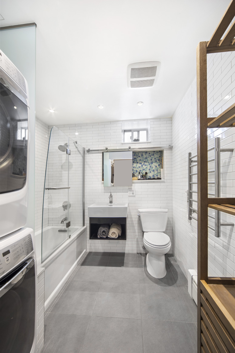 319 East 105th Street, Unit 5A Manhattan, NY 10029 - Photo 6 of 13 a spacious bathroom with a bathtub shower and toilet