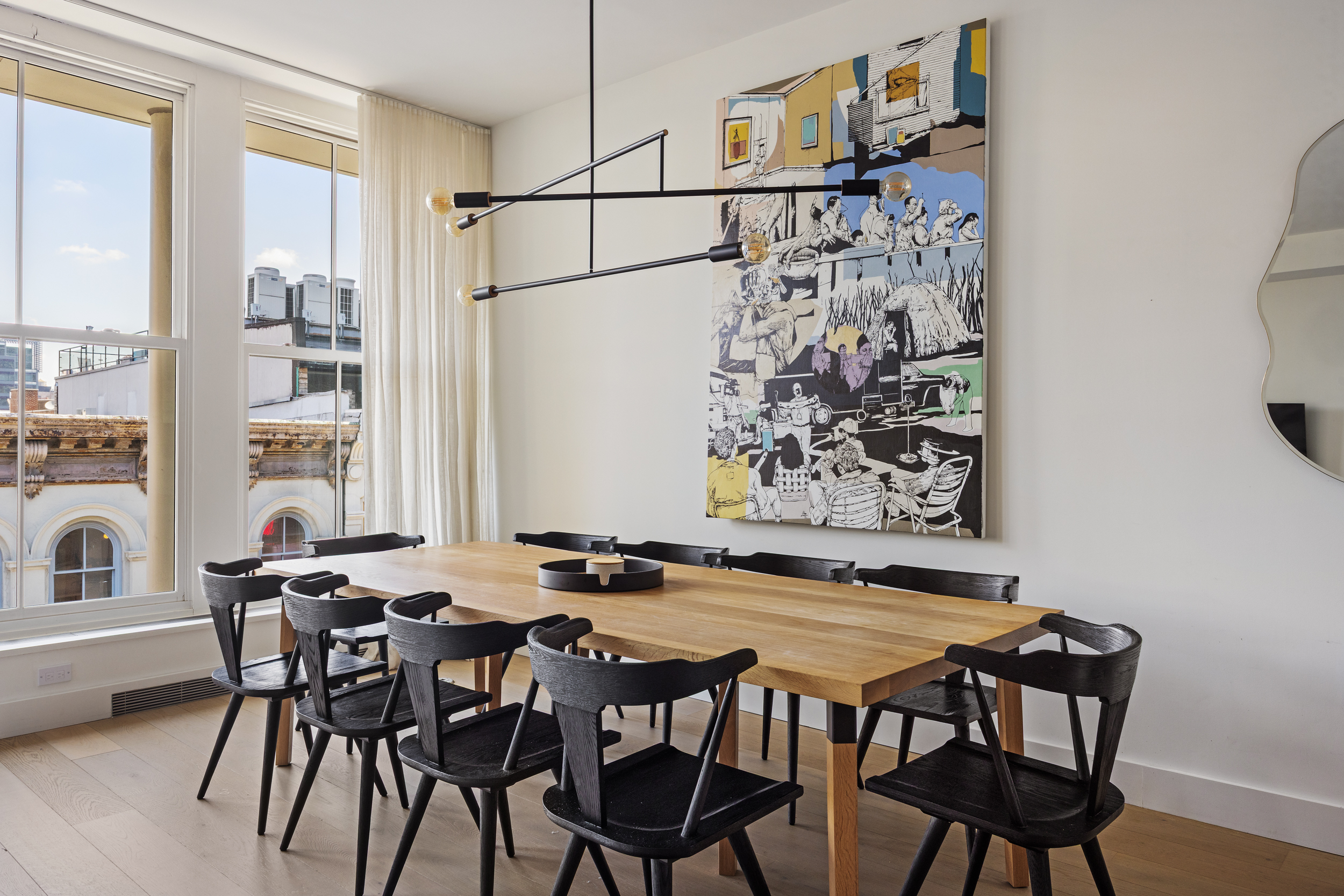 51 Walker Street, Unit 8B Manhattan, NY 10013 - Photo 5 of 16 a view of a dining room with furniture and a floor to ceiling window