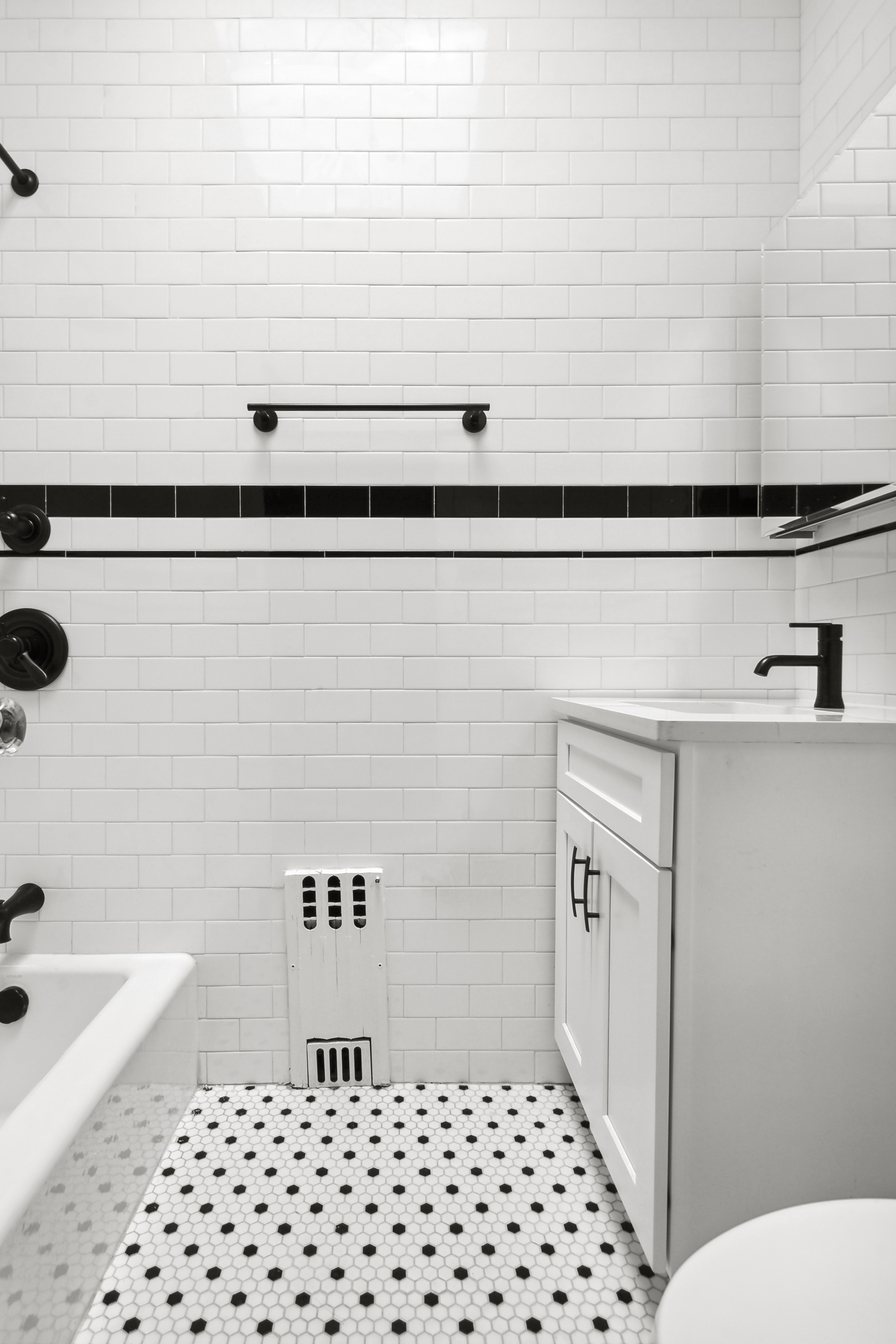 195 Rutland Road Brooklyn, NY 11225 - Photo 15 of 21 a bathroom with a sink a toilet and shower