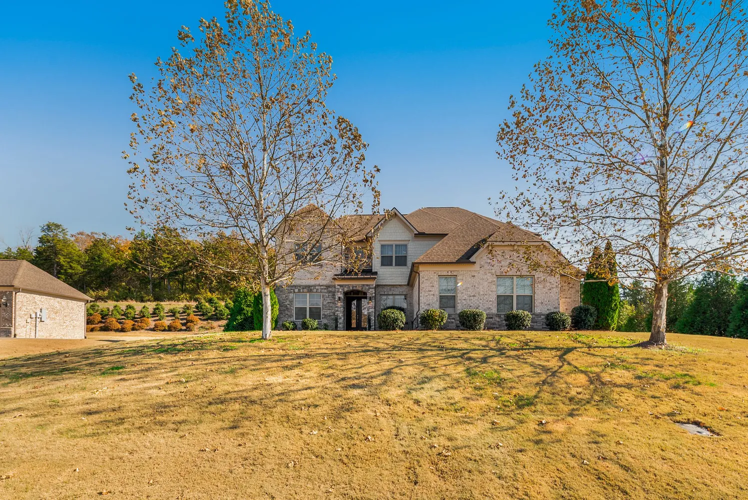 a front view of a house with a yard
