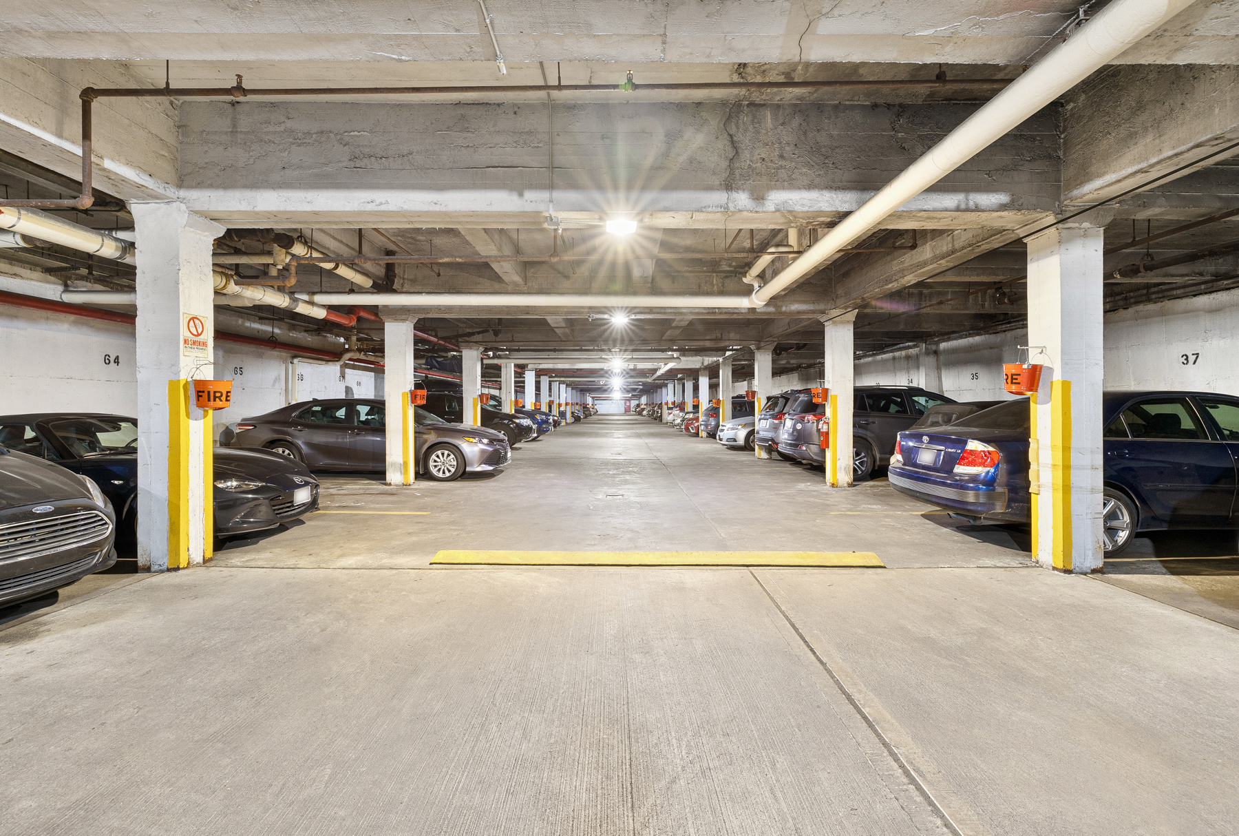 34-41 85th Street, Unit 4R Queens, NY 11372 - Photo 18 of 19 a view of parking garage with cars