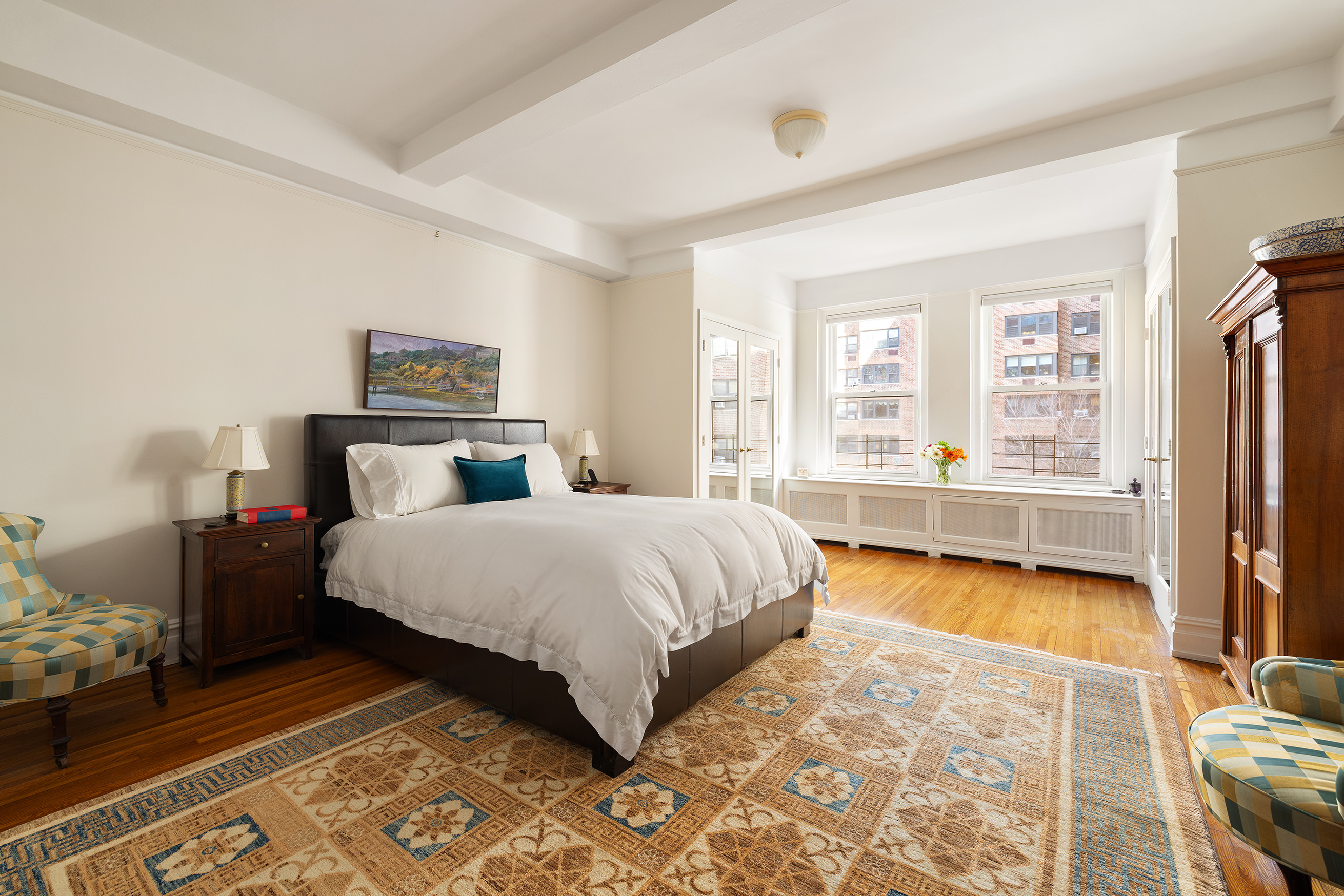 277 West End Avenue, Unit 5D Manhattan, NY 10023 - Photo 4 of 15 a bedroom with a bed and a couch