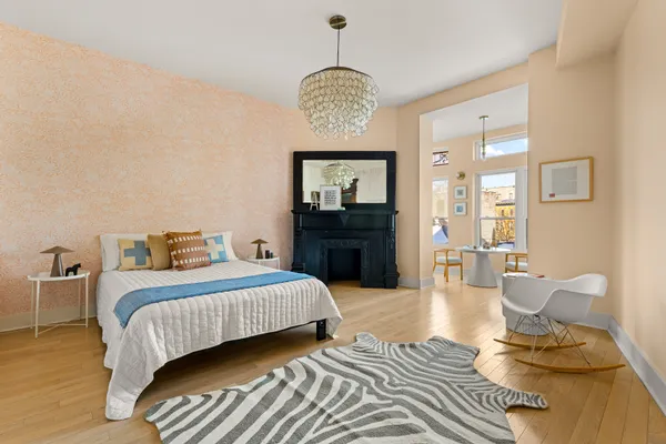 a bedroom with bed and window