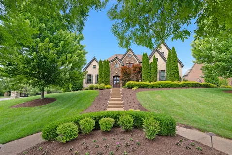 a front view of a house with a yard