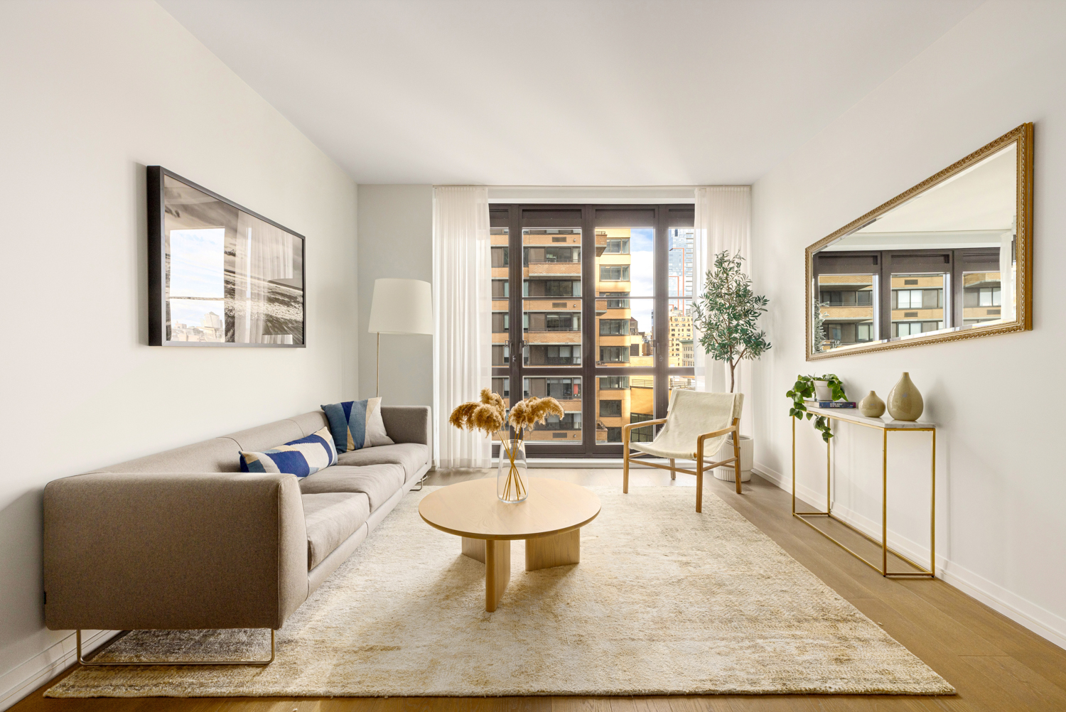 250 West 96th Street, Unit 14B Manhattan, NY 10025 - Photo 2 of 26 a living room with furniture a rug and a large window