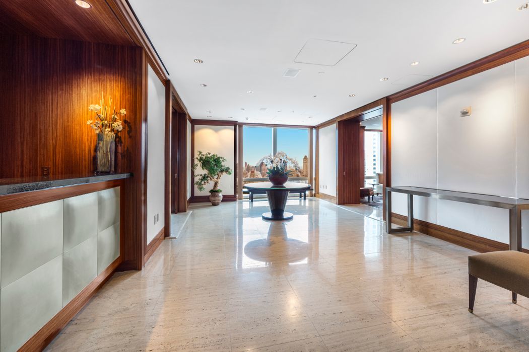 25 Columbus Circle, Unit 75A Manhattan, NY 10019 - Photo 31 of 36 a lobby with furniture and floor to ceiling window