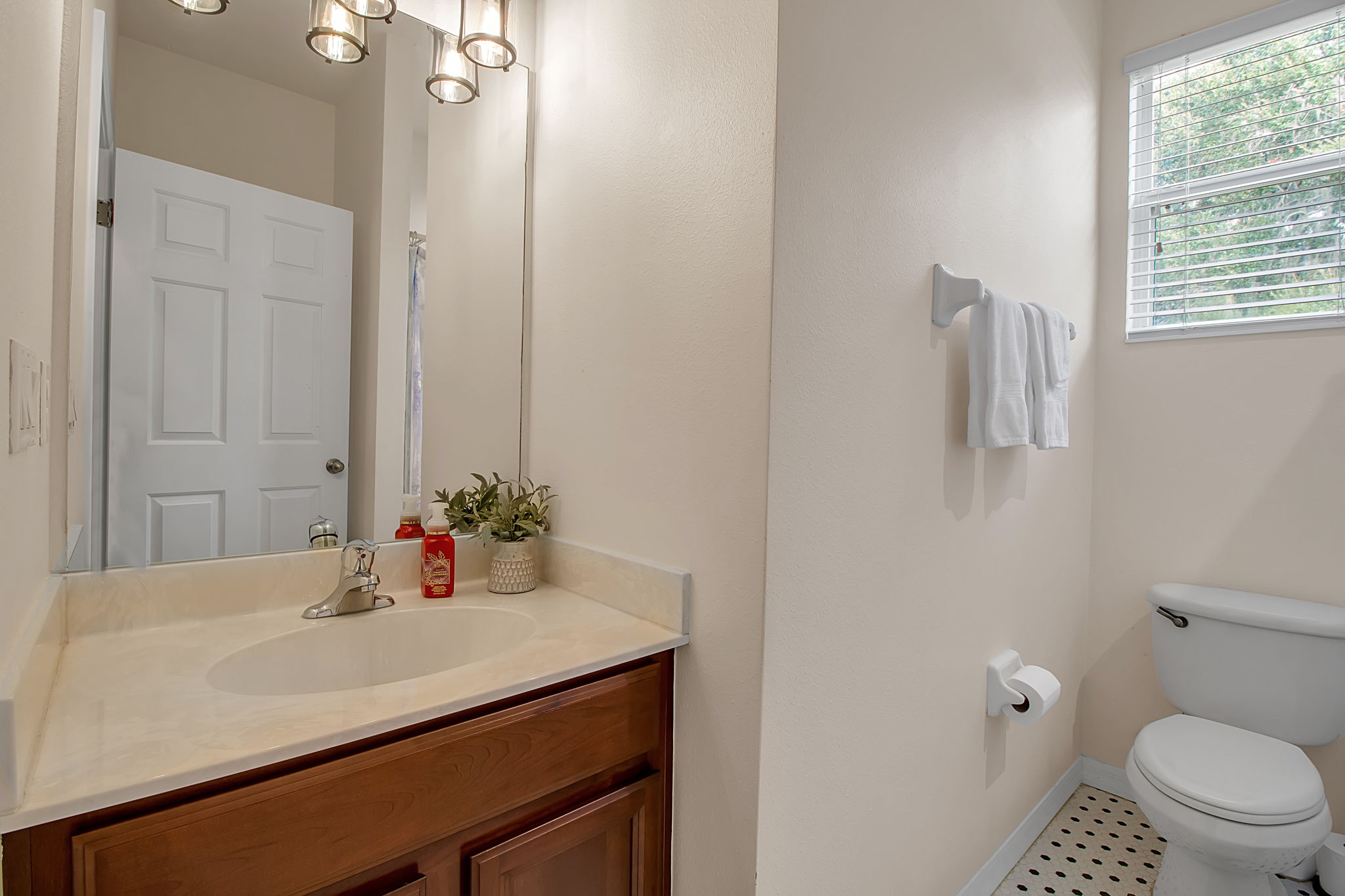 6106 34th Court East Bradenton, FL 34203 - Photo 49 of 69 a bathroom with a sink vanity and a toilet