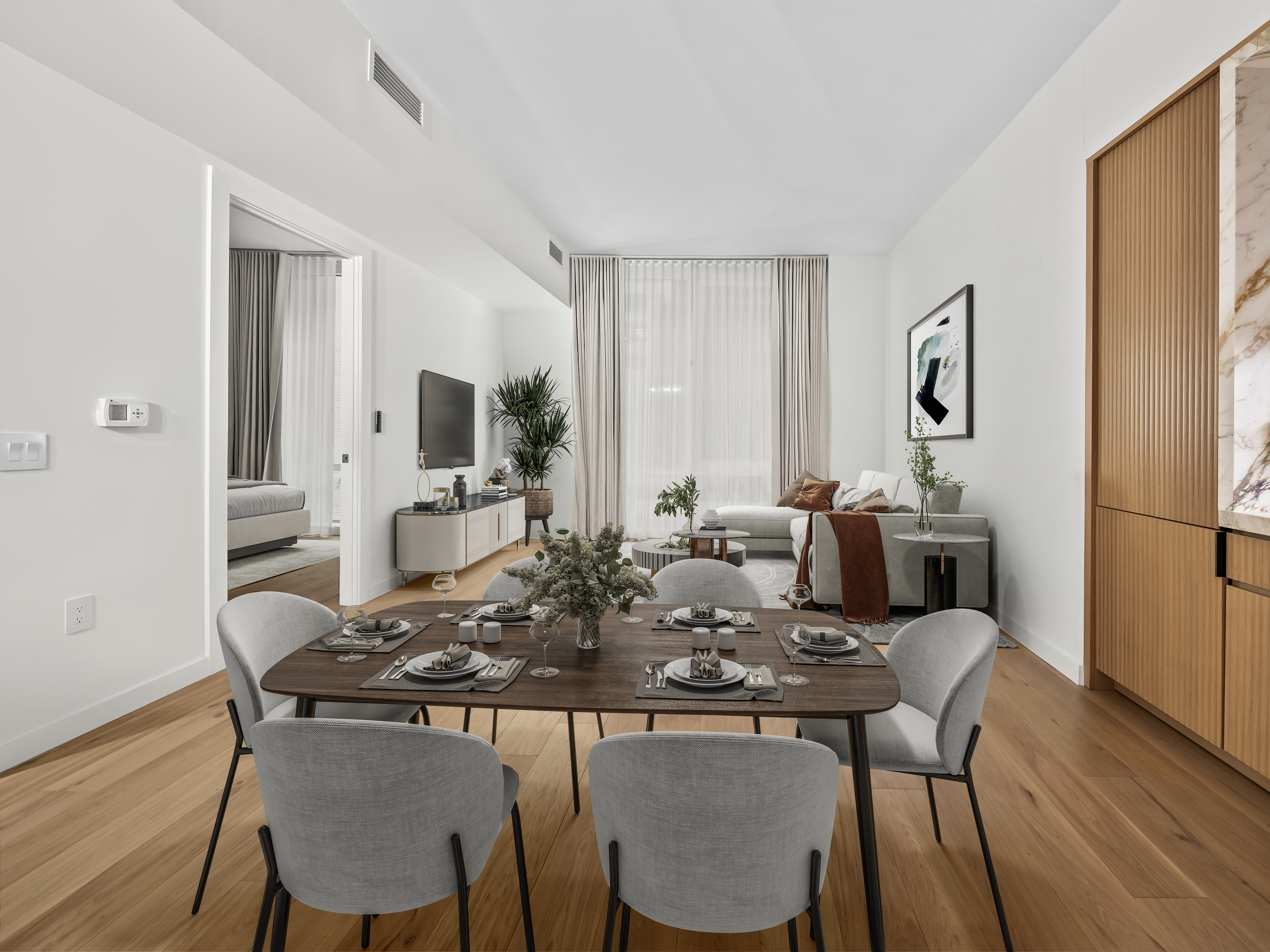 135 East 47th Street, Unit 4F Manhattan, NY 10017 - Photo 3 of 11 a view of a dining room with furniture and wooden floor