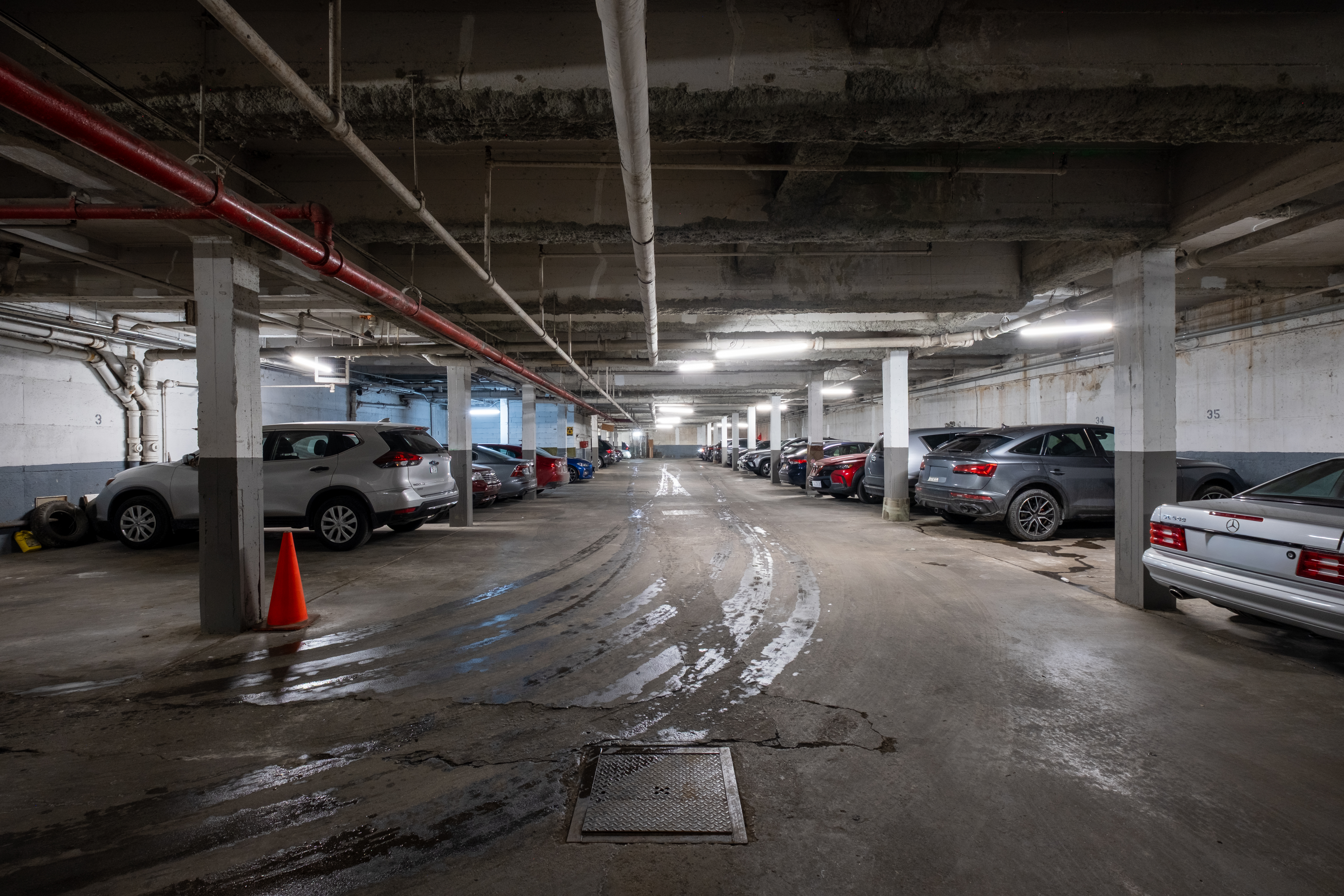 1577 East 17th Street, Unit 2F Brooklyn, NY 11230 - Photo 19 of 21 a view of parking garage with cars parked