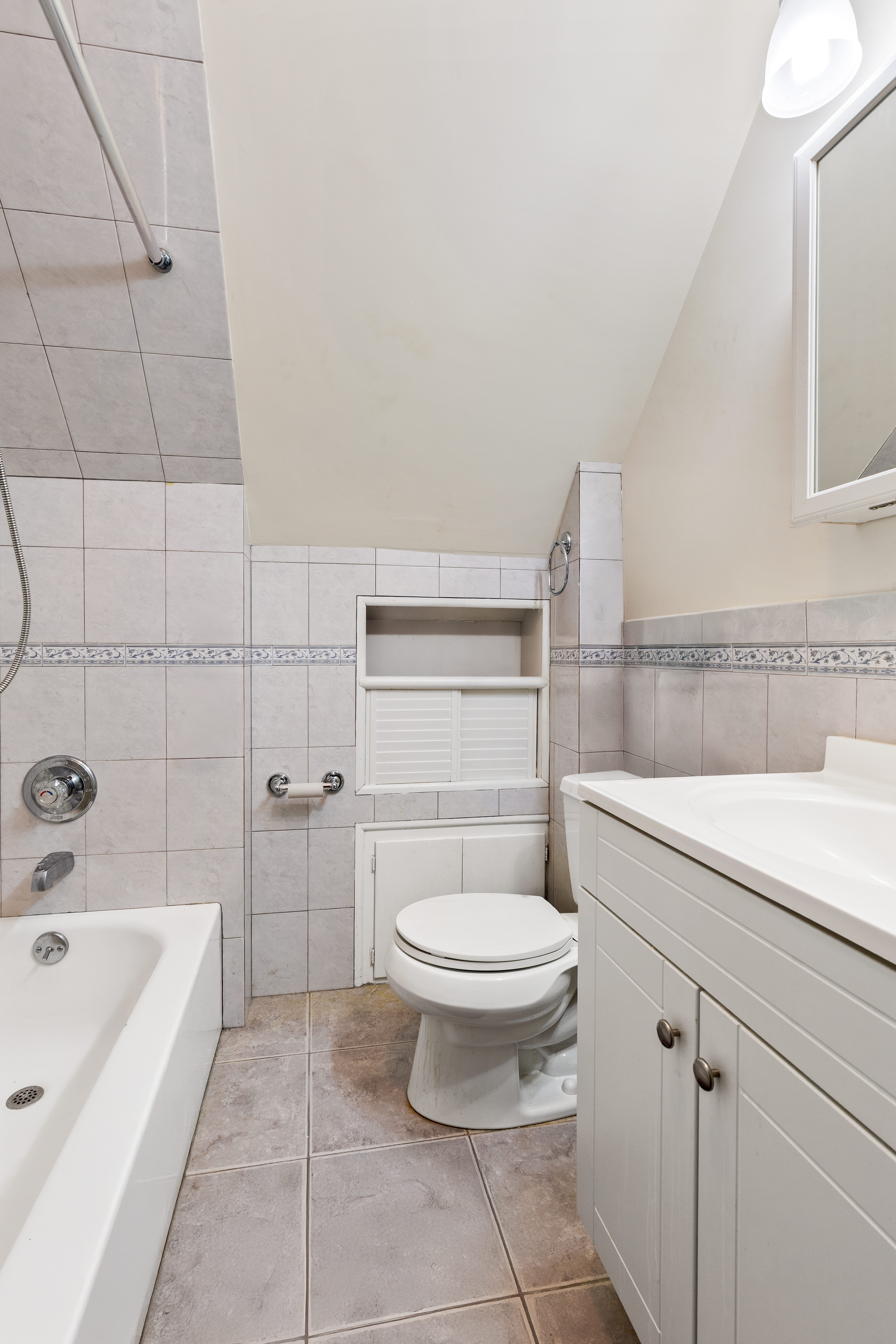 241-12 148th Avenue Queens, NY 11422 - Photo 9 of 15 a bathroom with a sink a toilet and bathtub