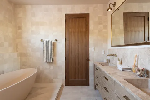 a bathroom with a sink vanity and a mirror