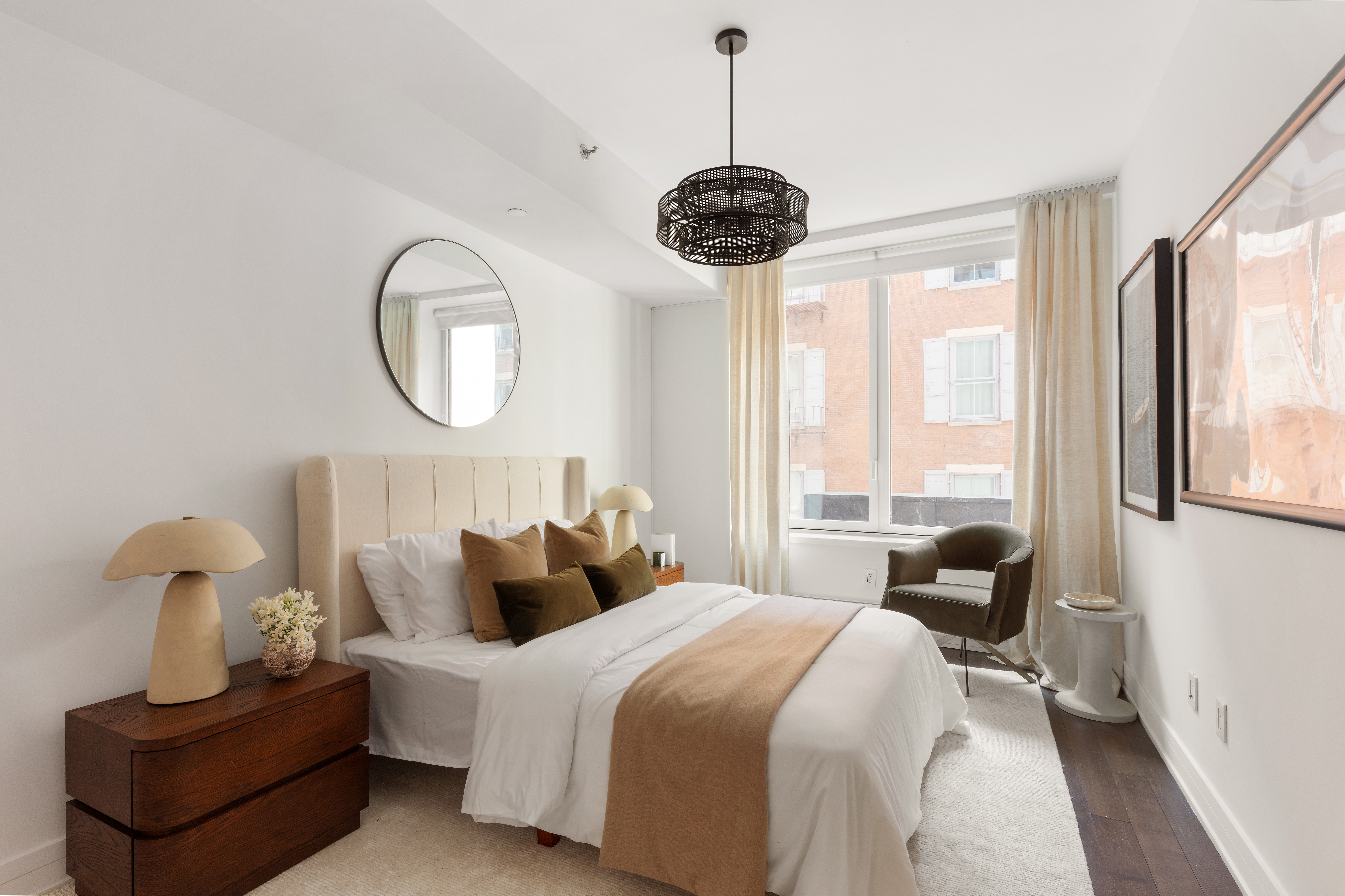 5 Franklin Place, Unit 3A Manhattan, NY 10013 - Photo 6 of 17 a bedroom with a bed and a chandelier