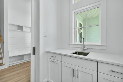 a bathroom with a sink toilet vanity and tub