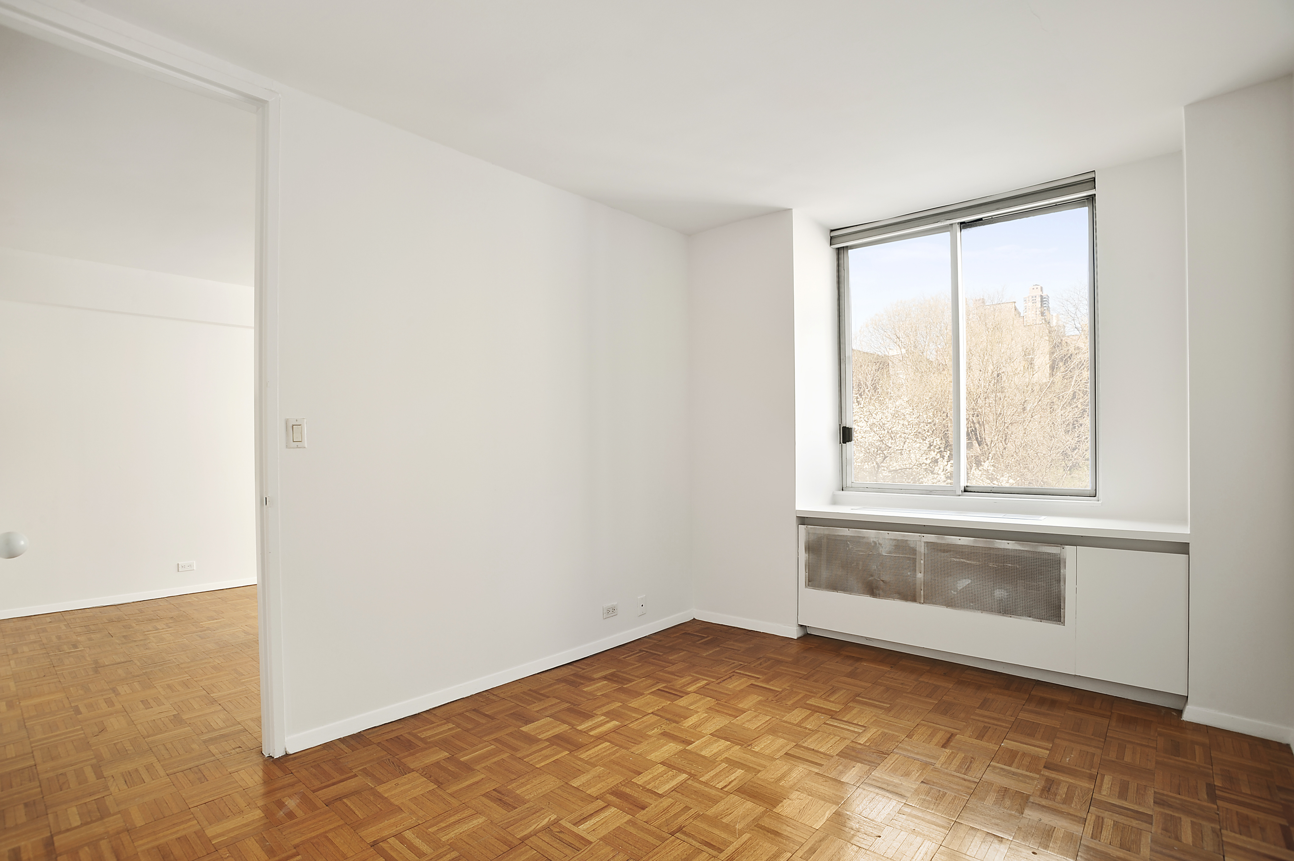 350 West 50th Street, Unit 4ZZ Manhattan, NY 10019 - Photo 2 of 5 an empty room with window