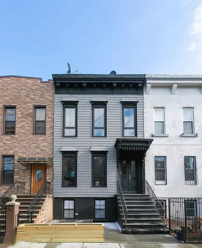 1128 Halsey Street, Unit 1 Brooklyn, NY 11207 - Photo 6 of 6 a front view of a house with glass windows
