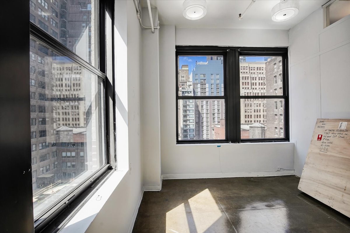 146 West 29th Street, Unit 9W Manhattan, NY 10001 - Photo 3 of 10 a view of an empty room with a window