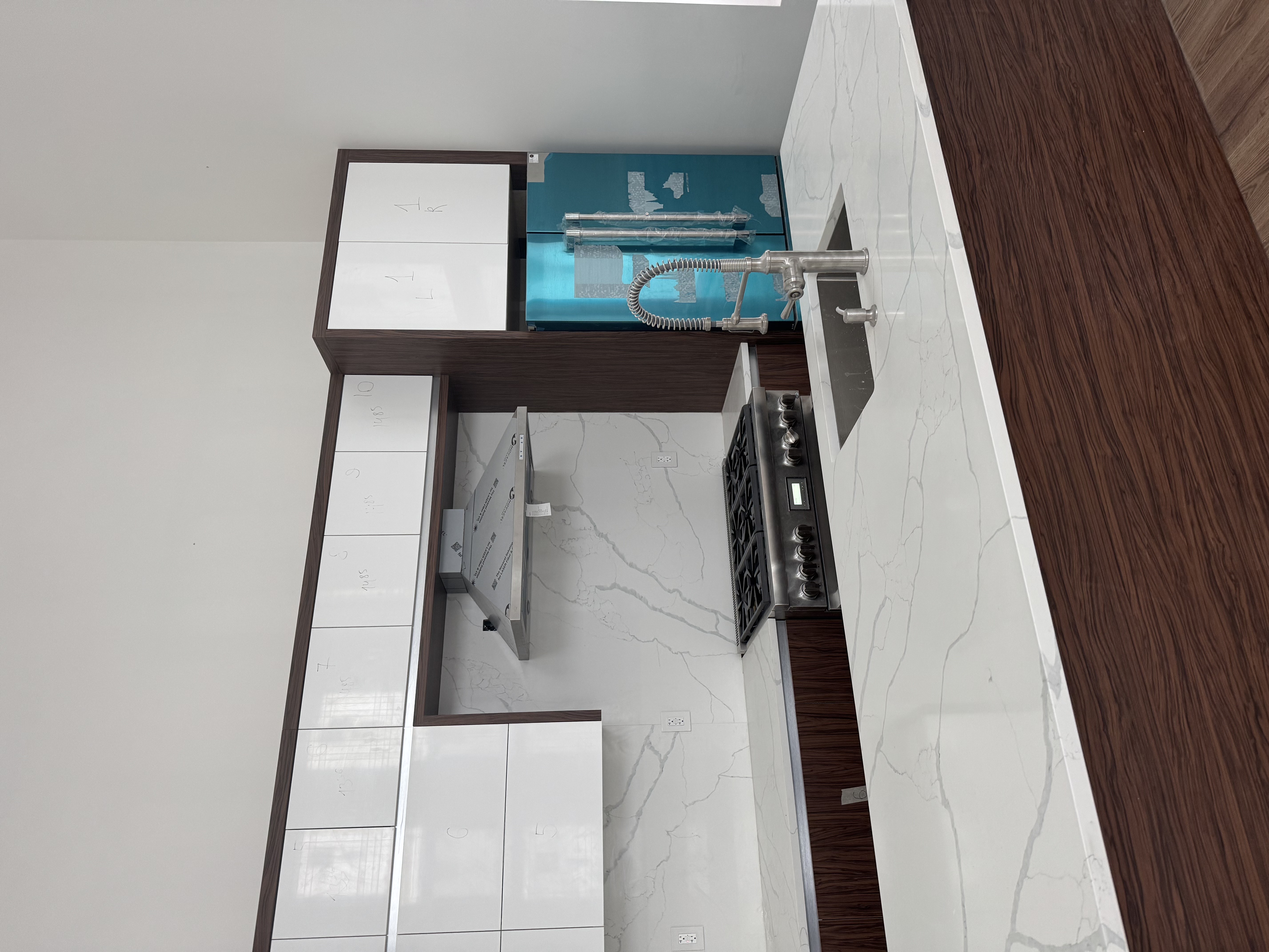 2813 Brown Street Brooklyn, NY 11235 - Photo 2 of 4 a kitchen with a sink and cabinets