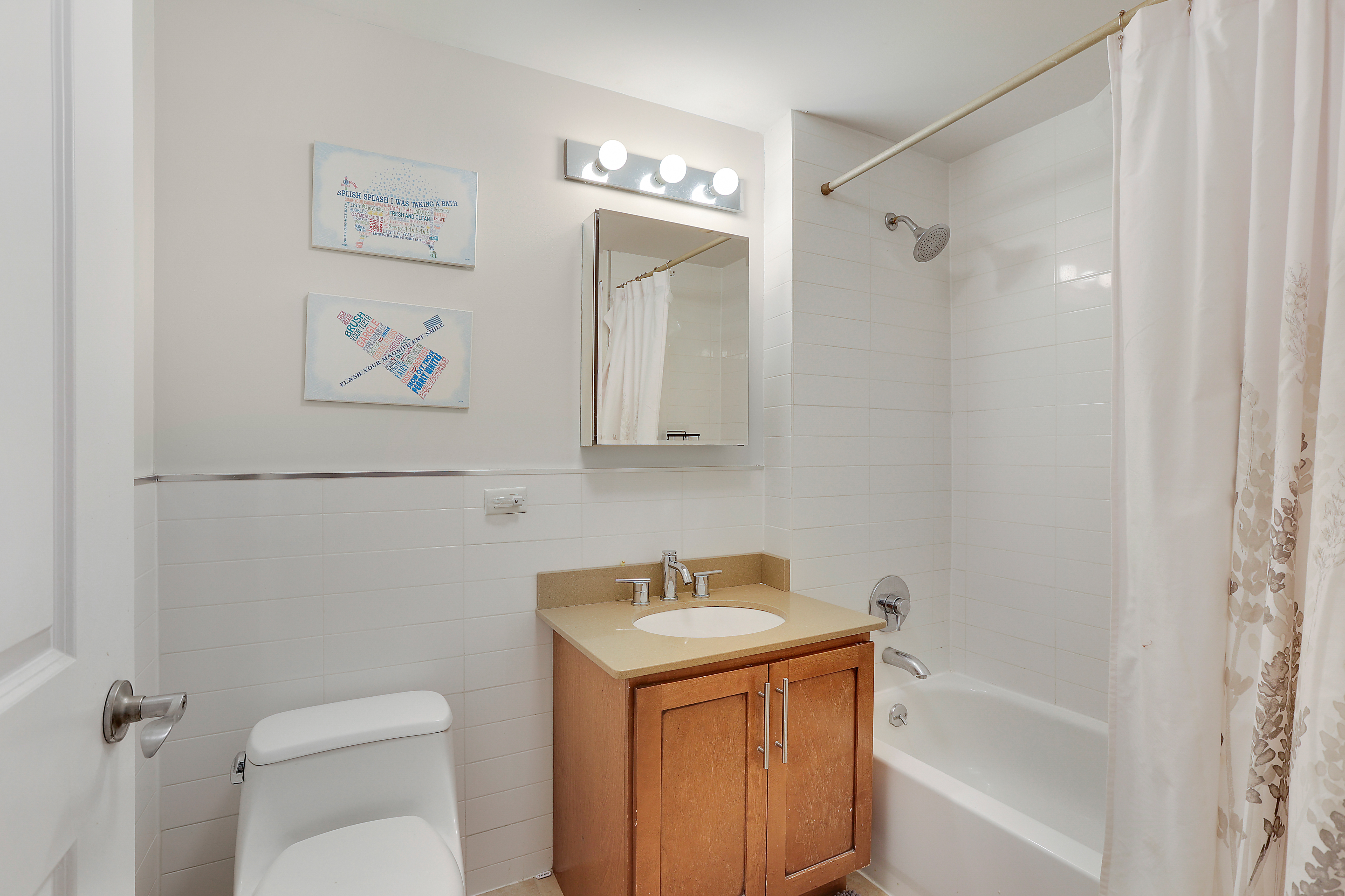 313 West 119th Street, Unit PHE Manhattan, NY 10027 - Photo 11 of 19 a bathroom with a sink a toilet and shower