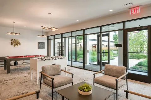 a living room with lots of furniture and a rug